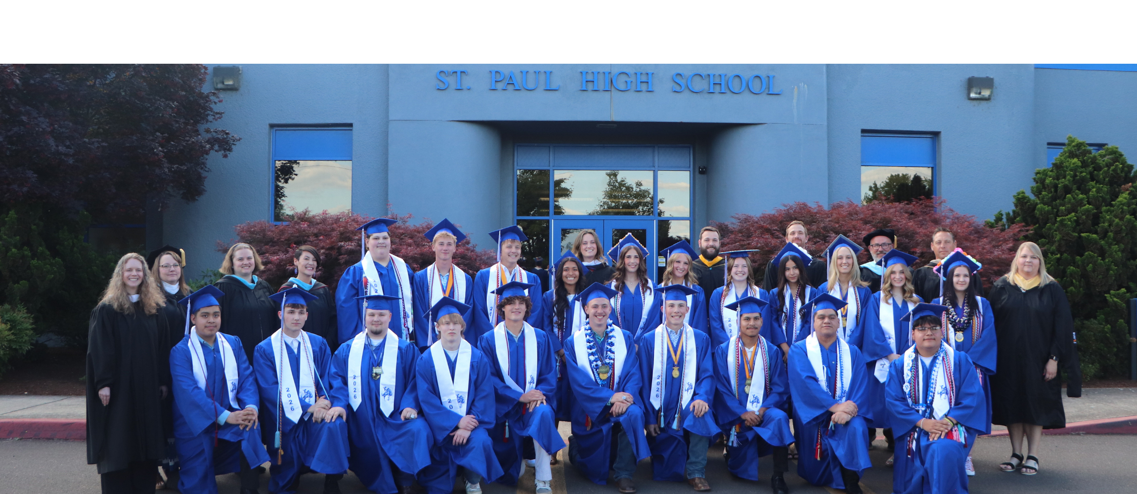 All St. Paul High School graduating seniors in front of the high school building.