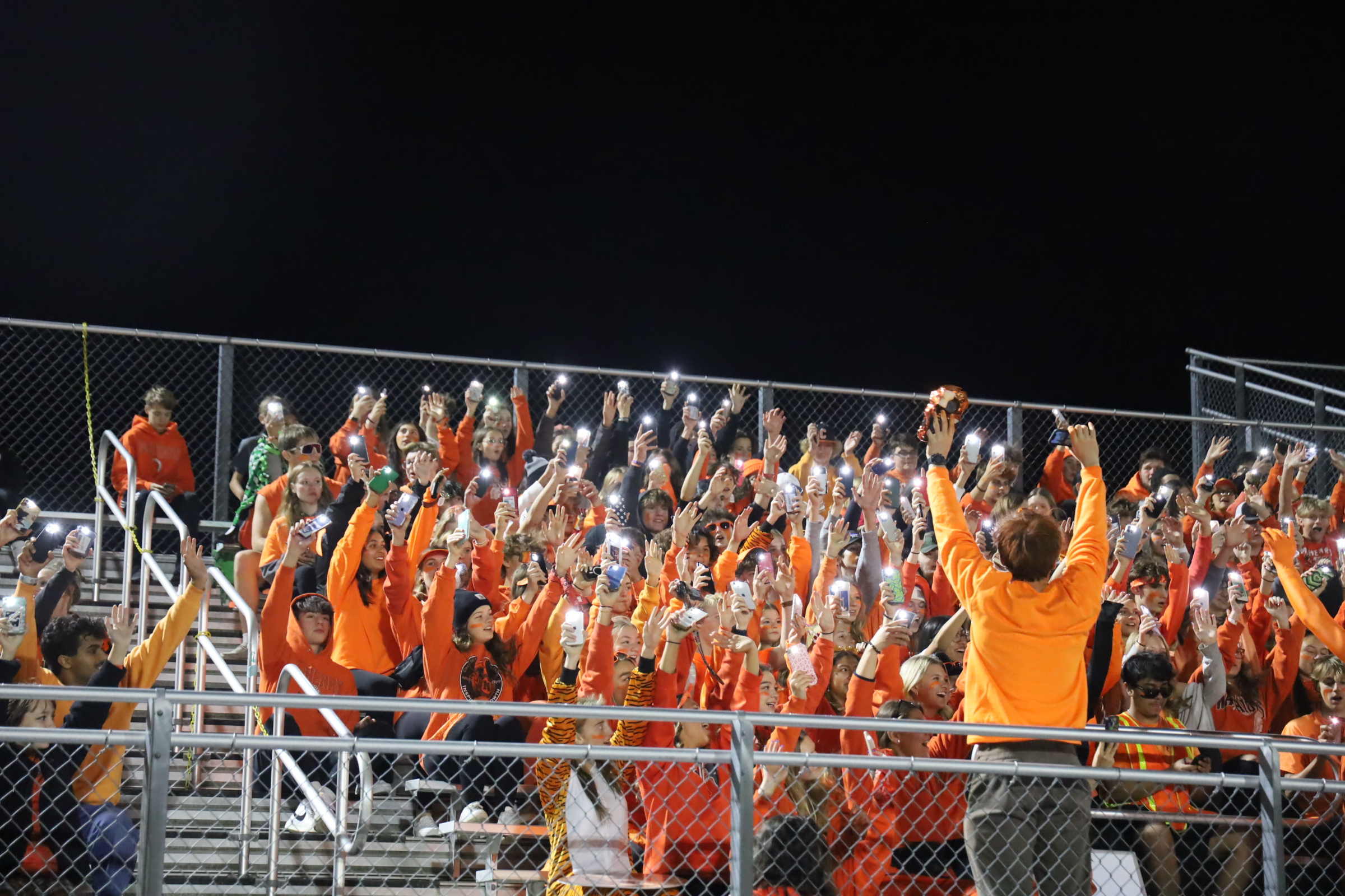 Fans all in orange in the stands