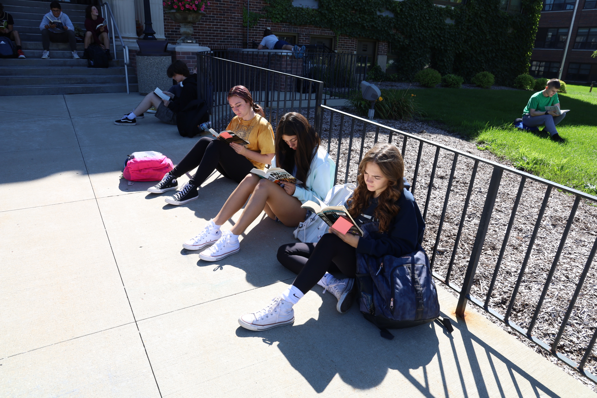 Students reading outside