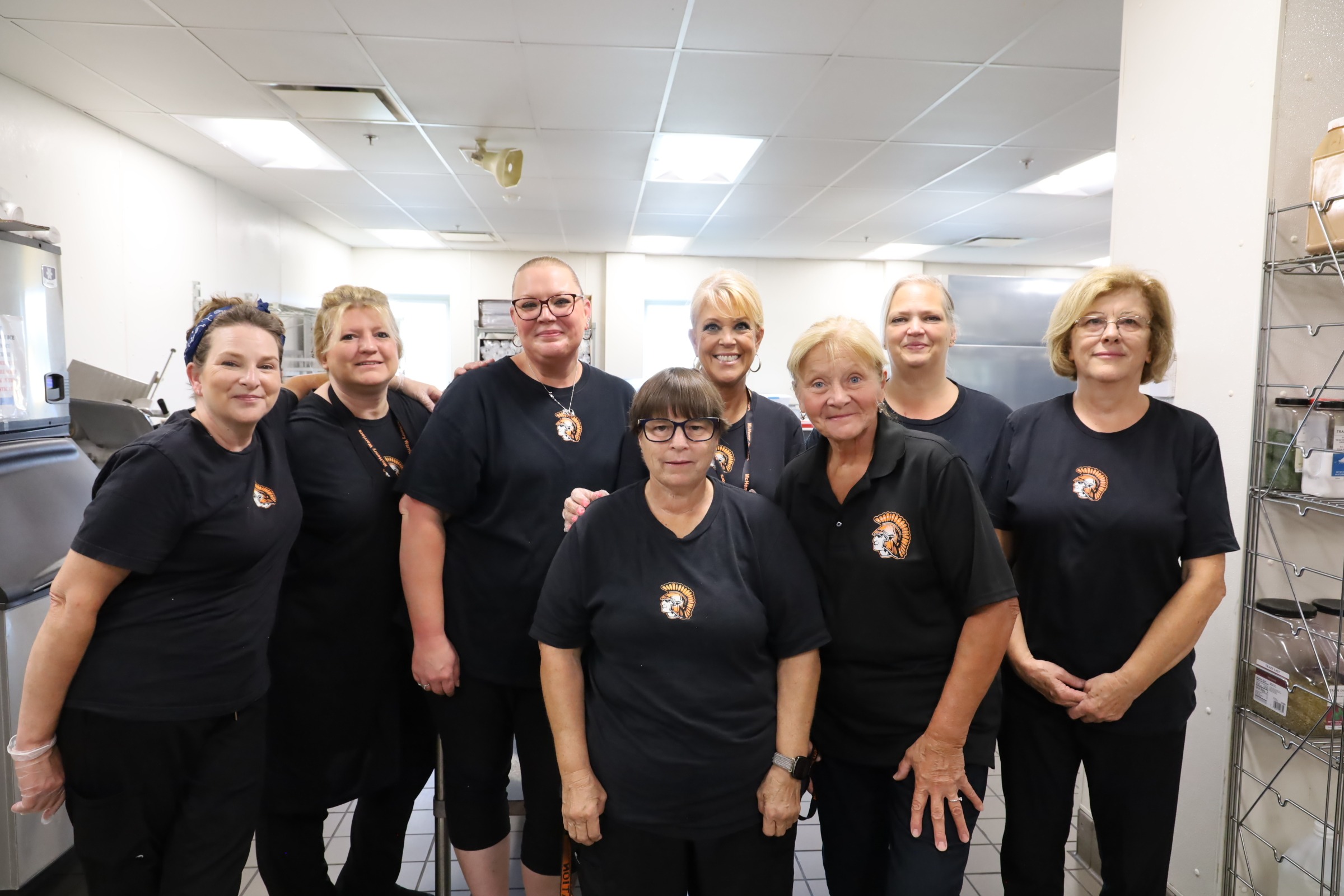 Eight members of food service staff at Upper Campus