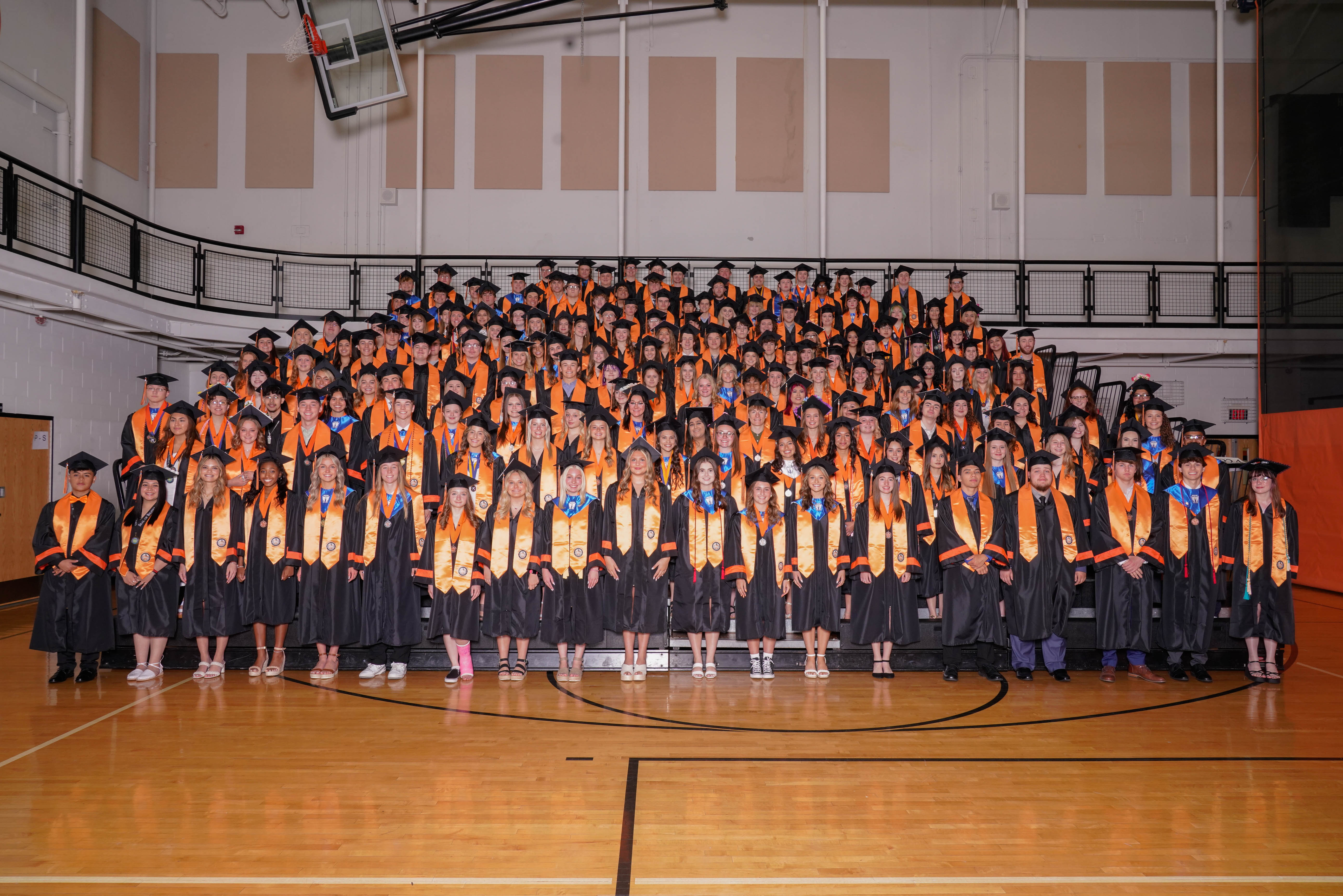 Distinguished Warriors in stoles and in the gym class of 2023