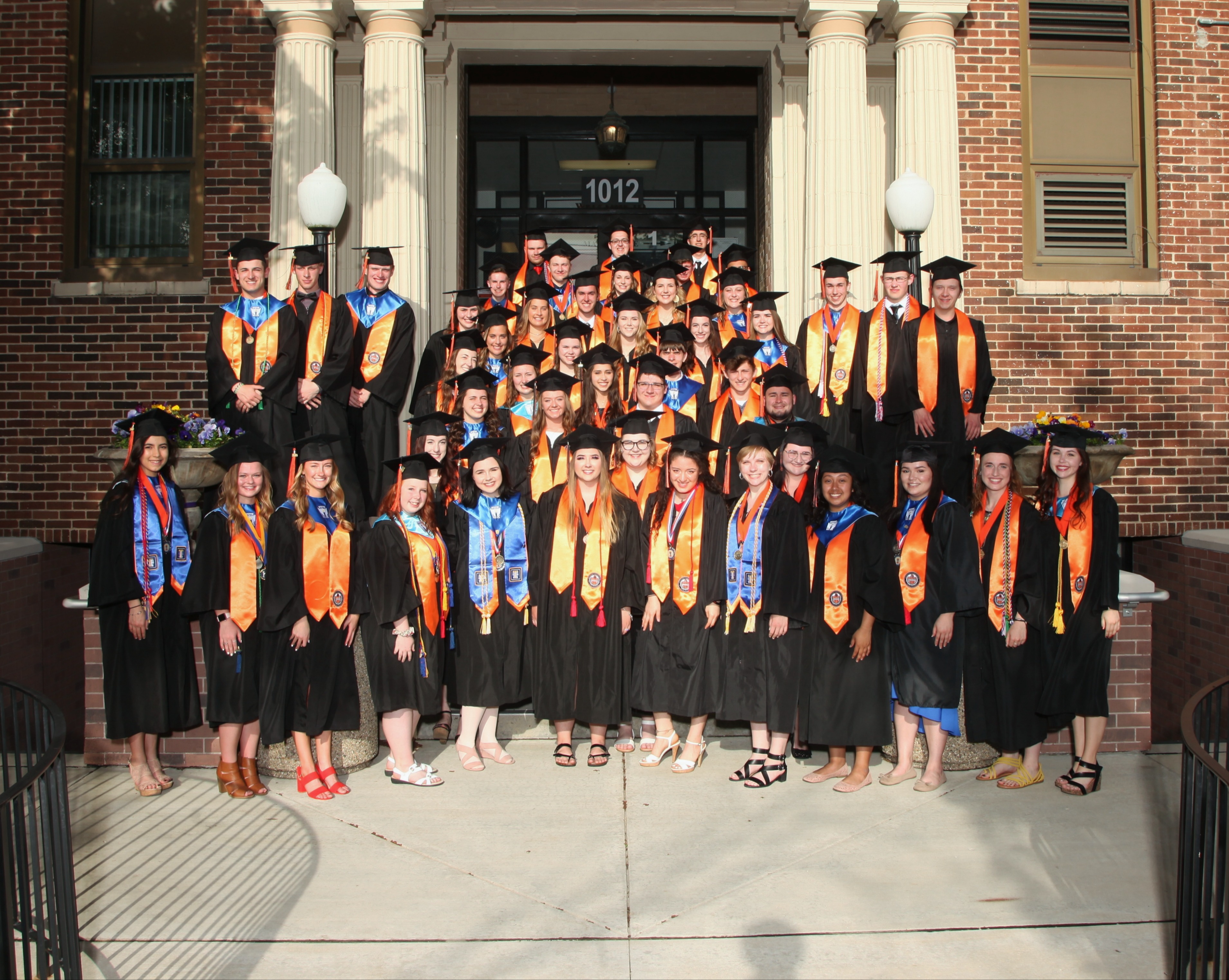 Distinguished Warriors Class of 2019 East Campus in stoles in front of East Campus. Class of 2019