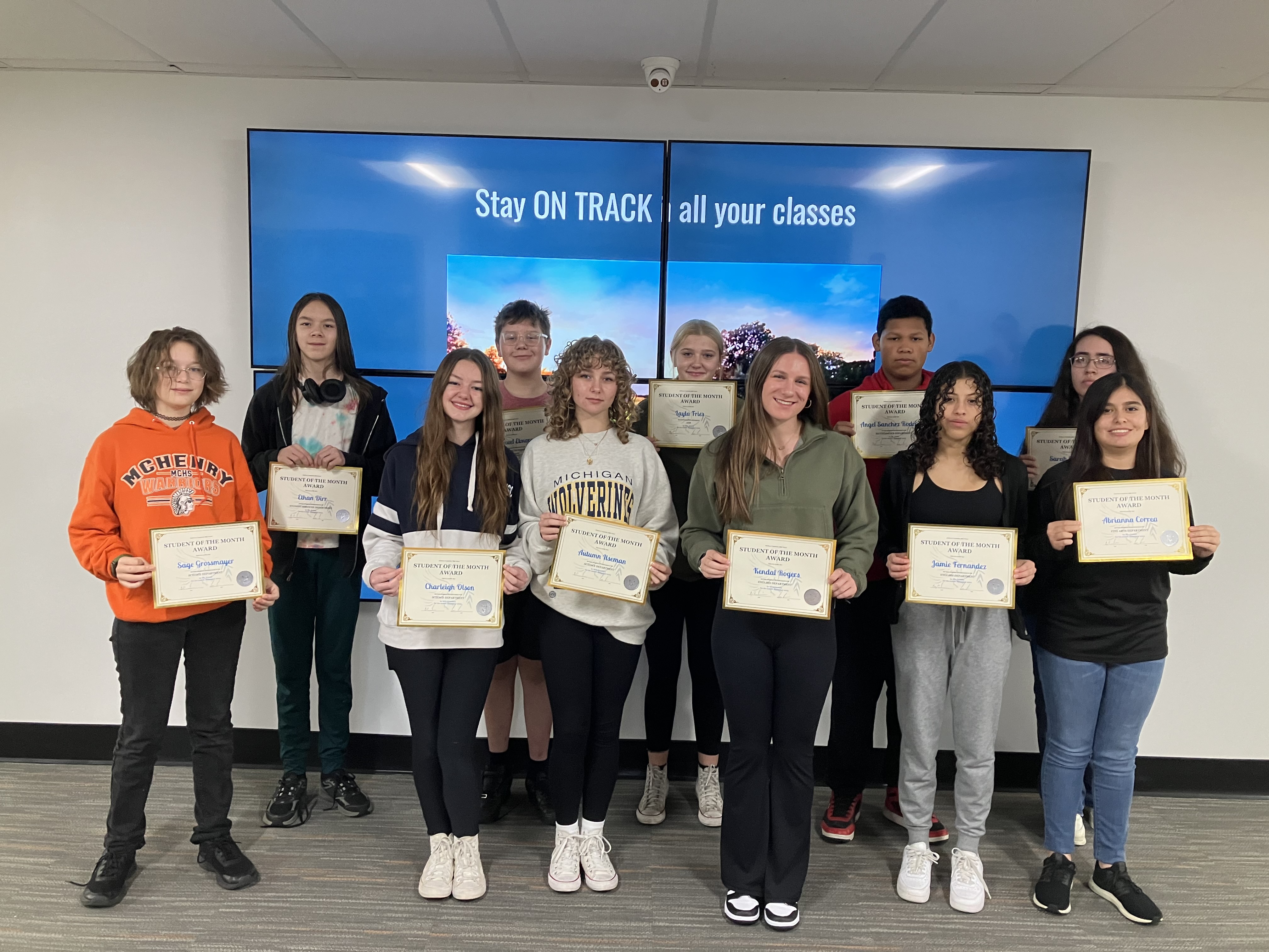 Students holding their awards