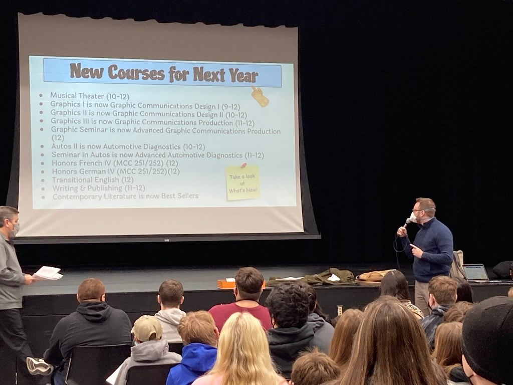 Counselor talking in front of a slide presentation