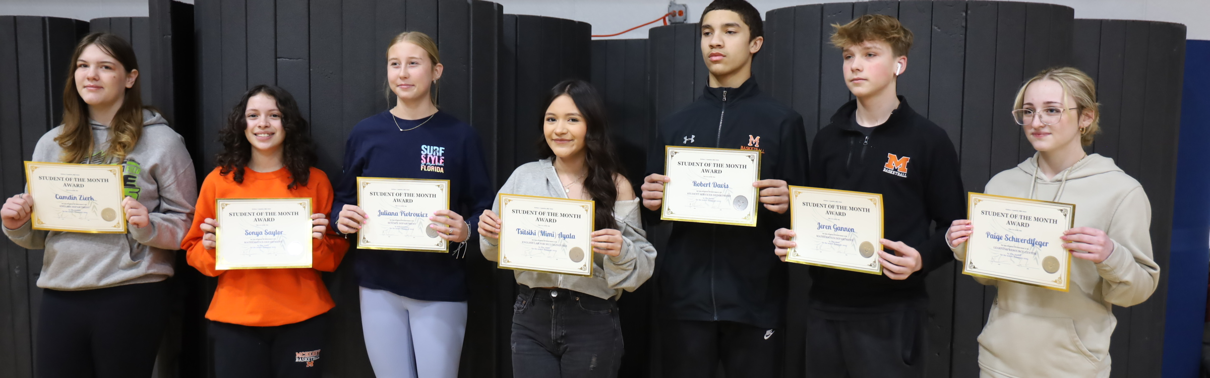 Freshmen holding their student of the month awards