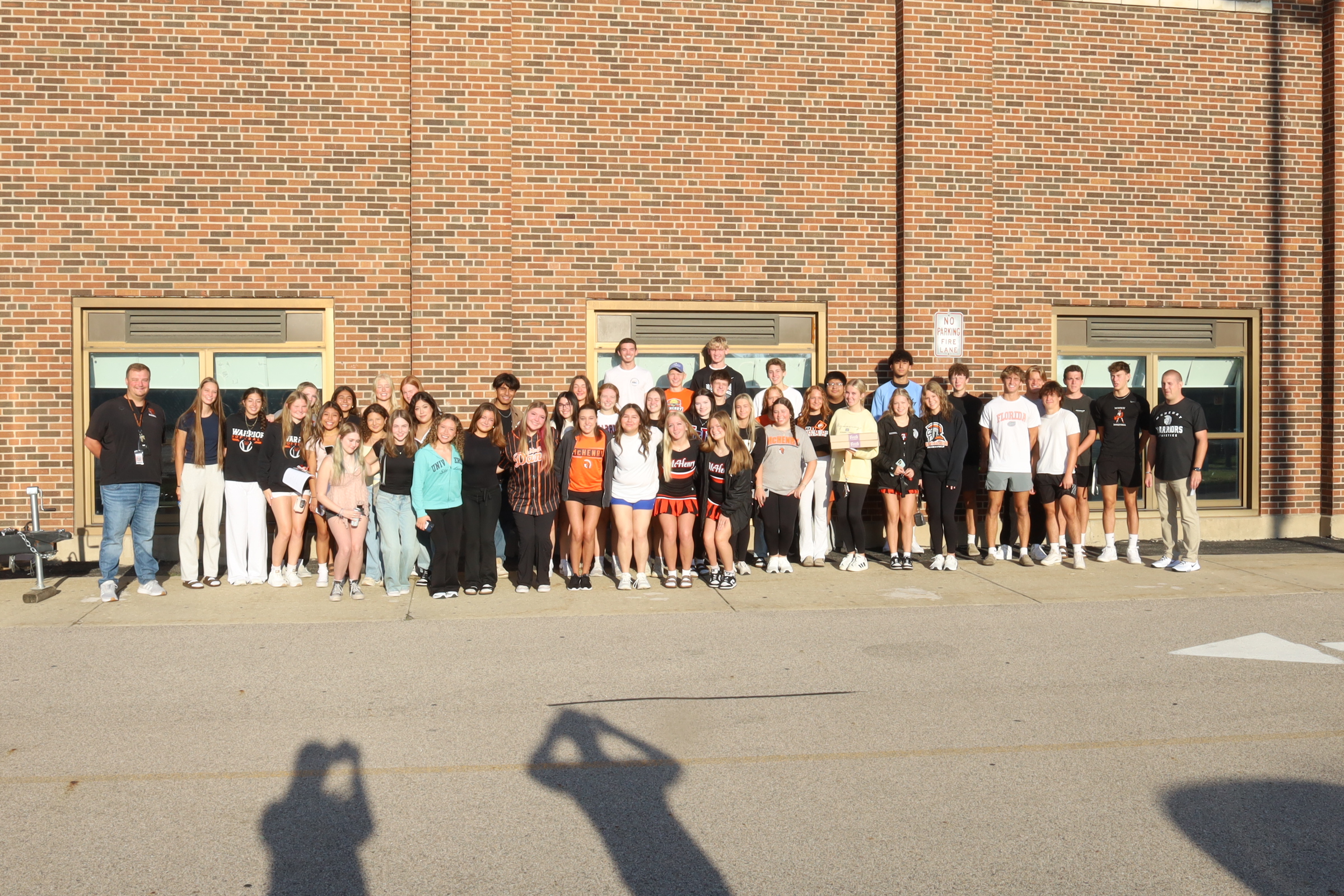 Leadership in Action Students in front of Freshman Campus