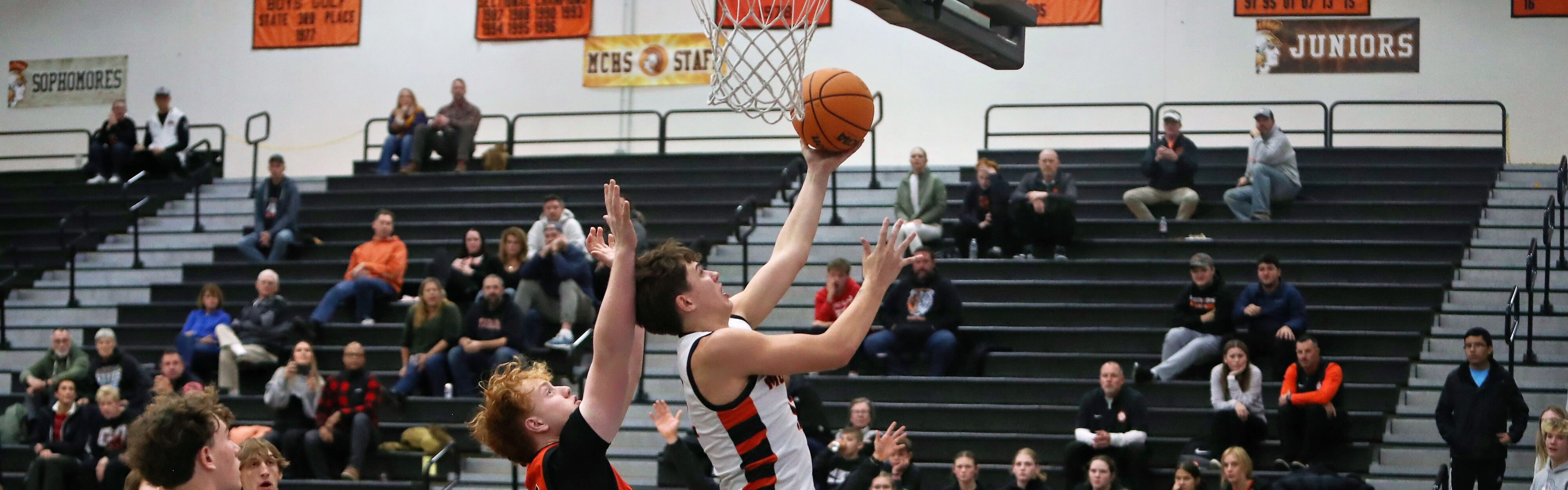 Boy shooting a basketball 
