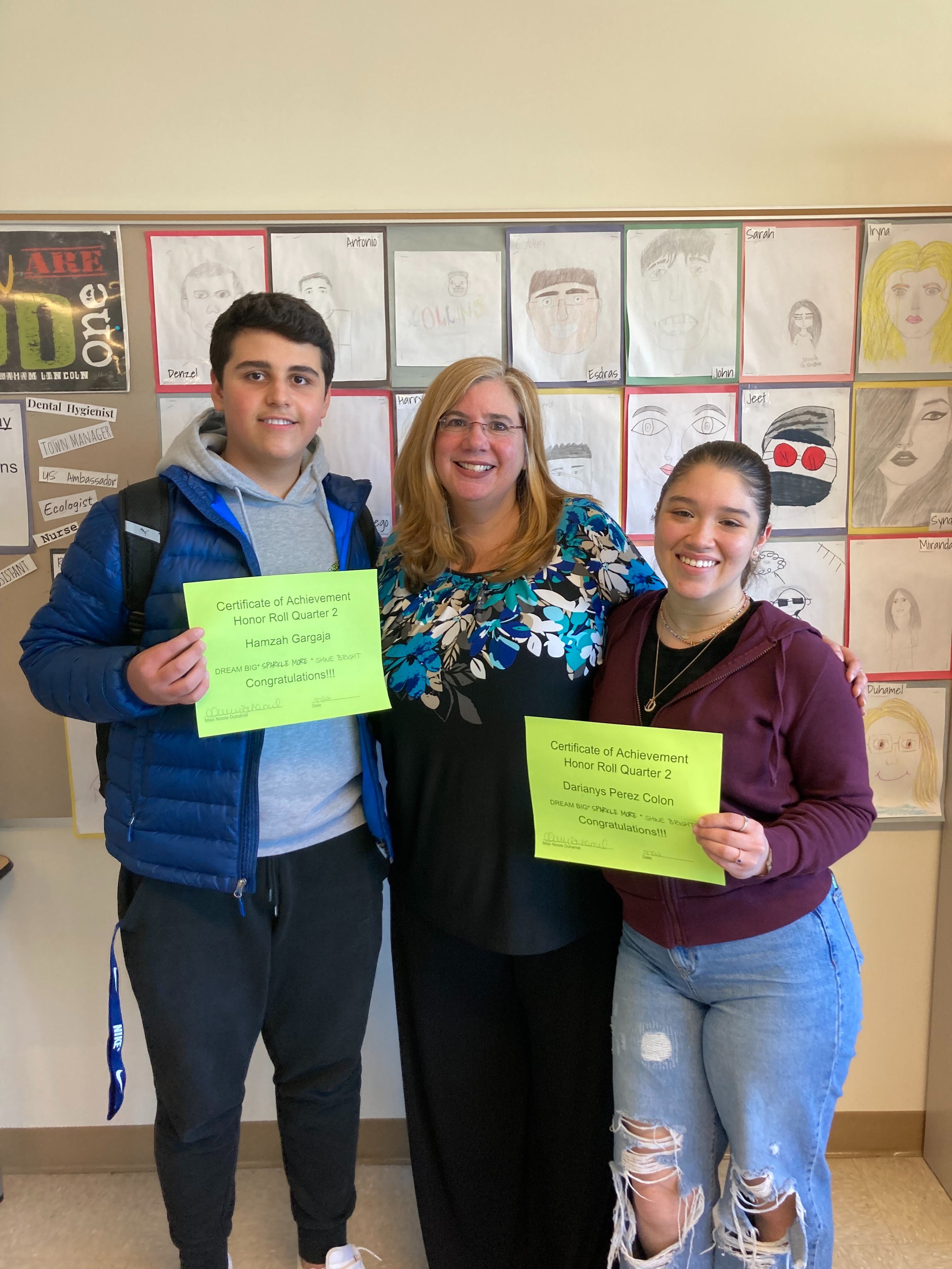 Teacher and students smiling