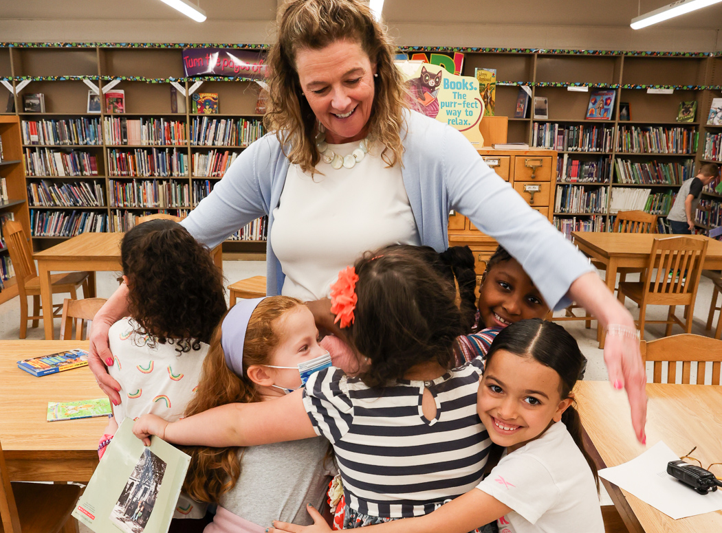 dracut-teacher-students-hug