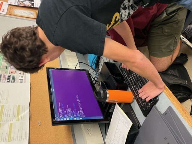 Cybersecurity students participating in a Cyberpatriots competition