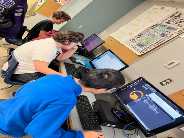Cybersecurity students participating in a Cyberpatriots competition