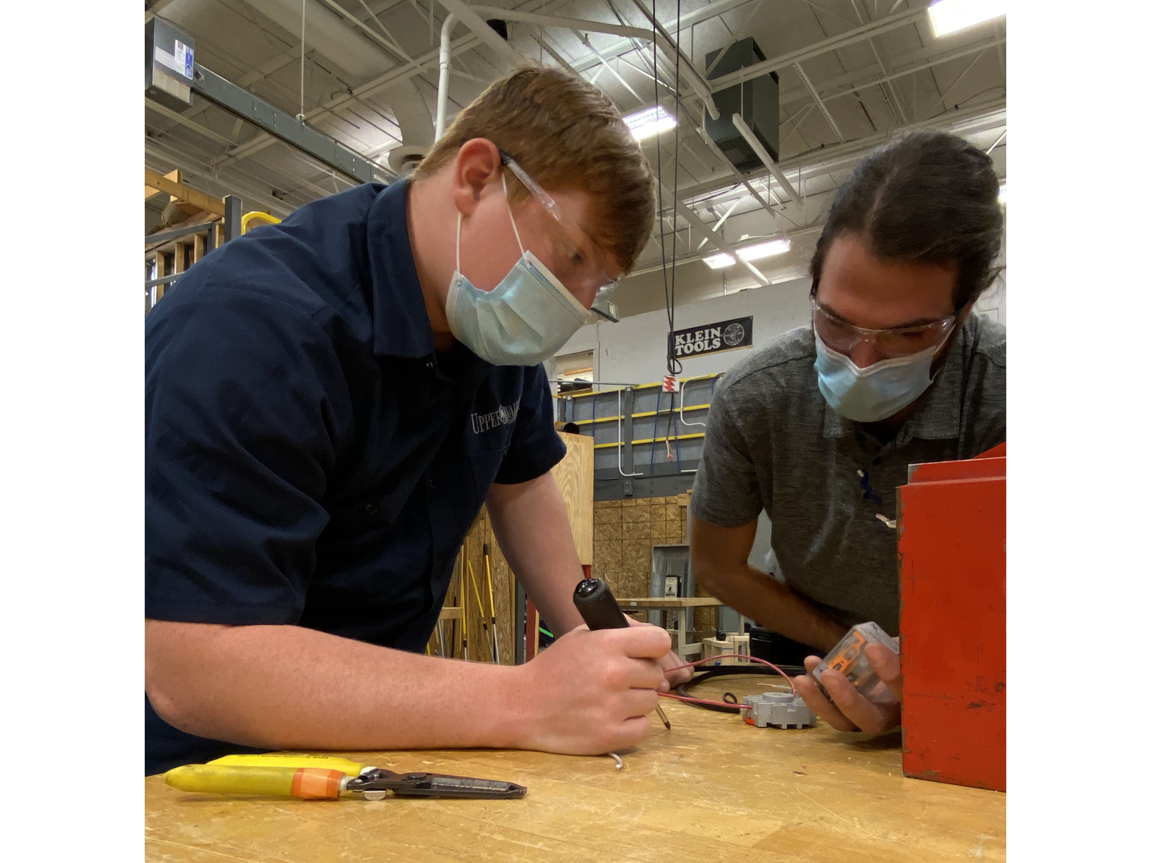 Electrical Trades Students working in their lab