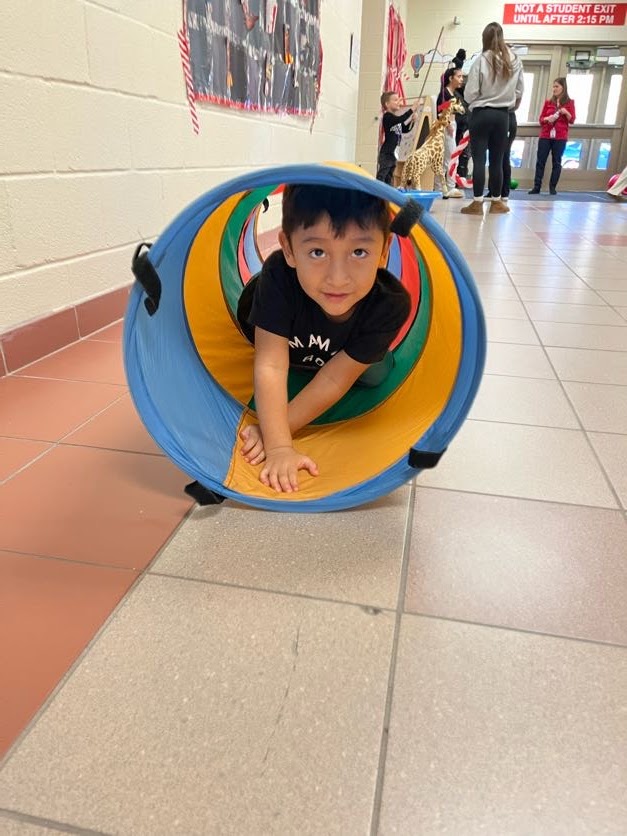 preschool student in tube