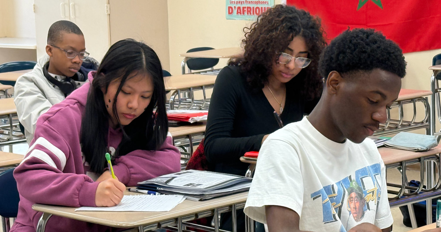 four students studying in class