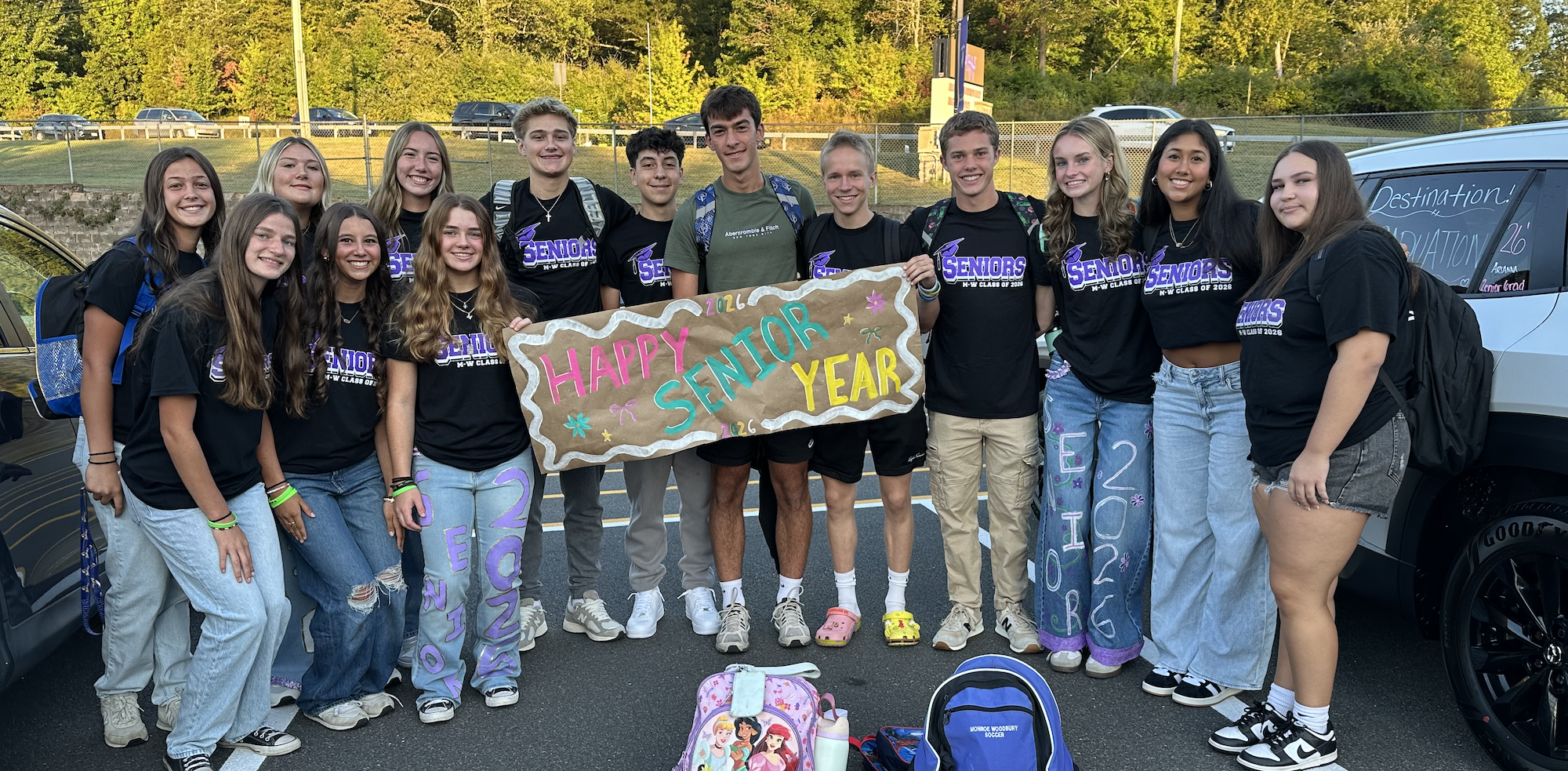 seniors holding sign