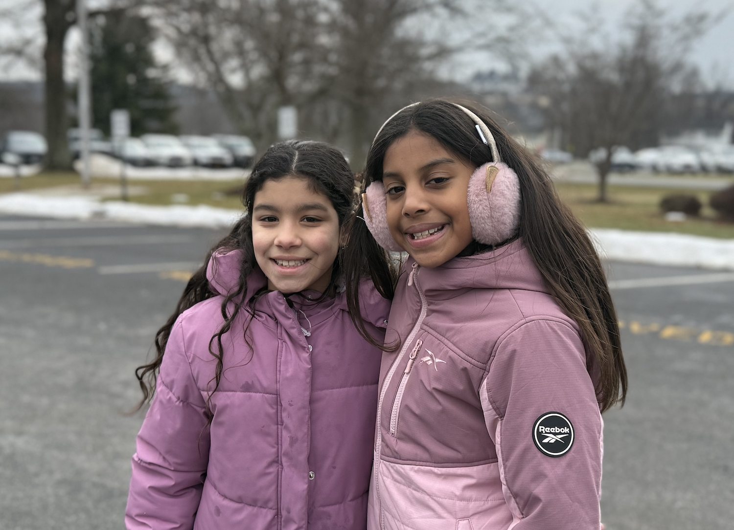 two students with pink coats
