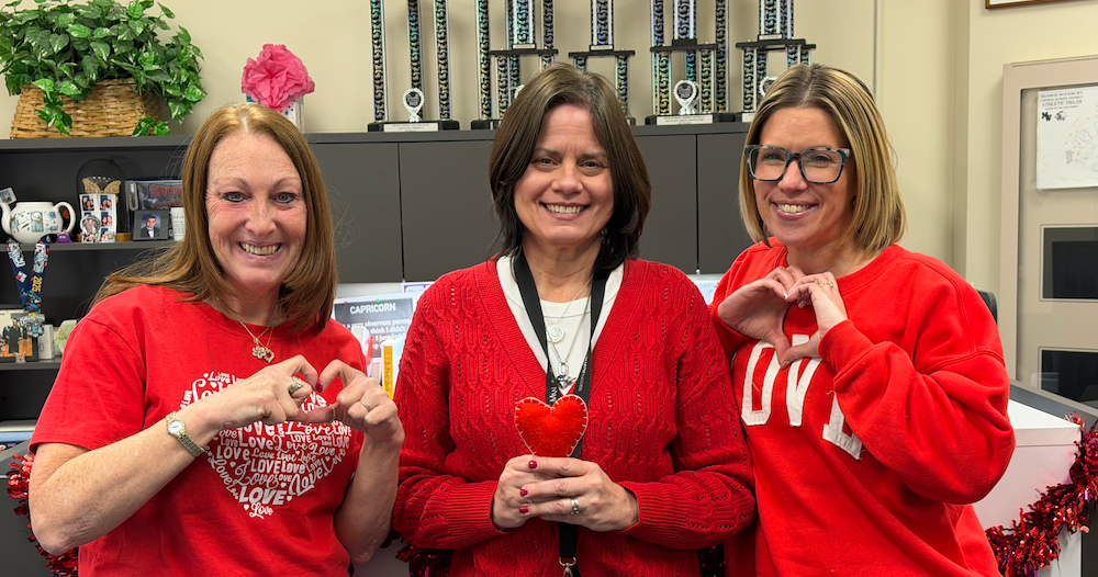 vice principal and front office staff wear red for heart health