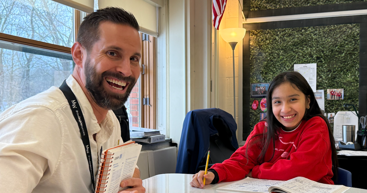 man and student smiling