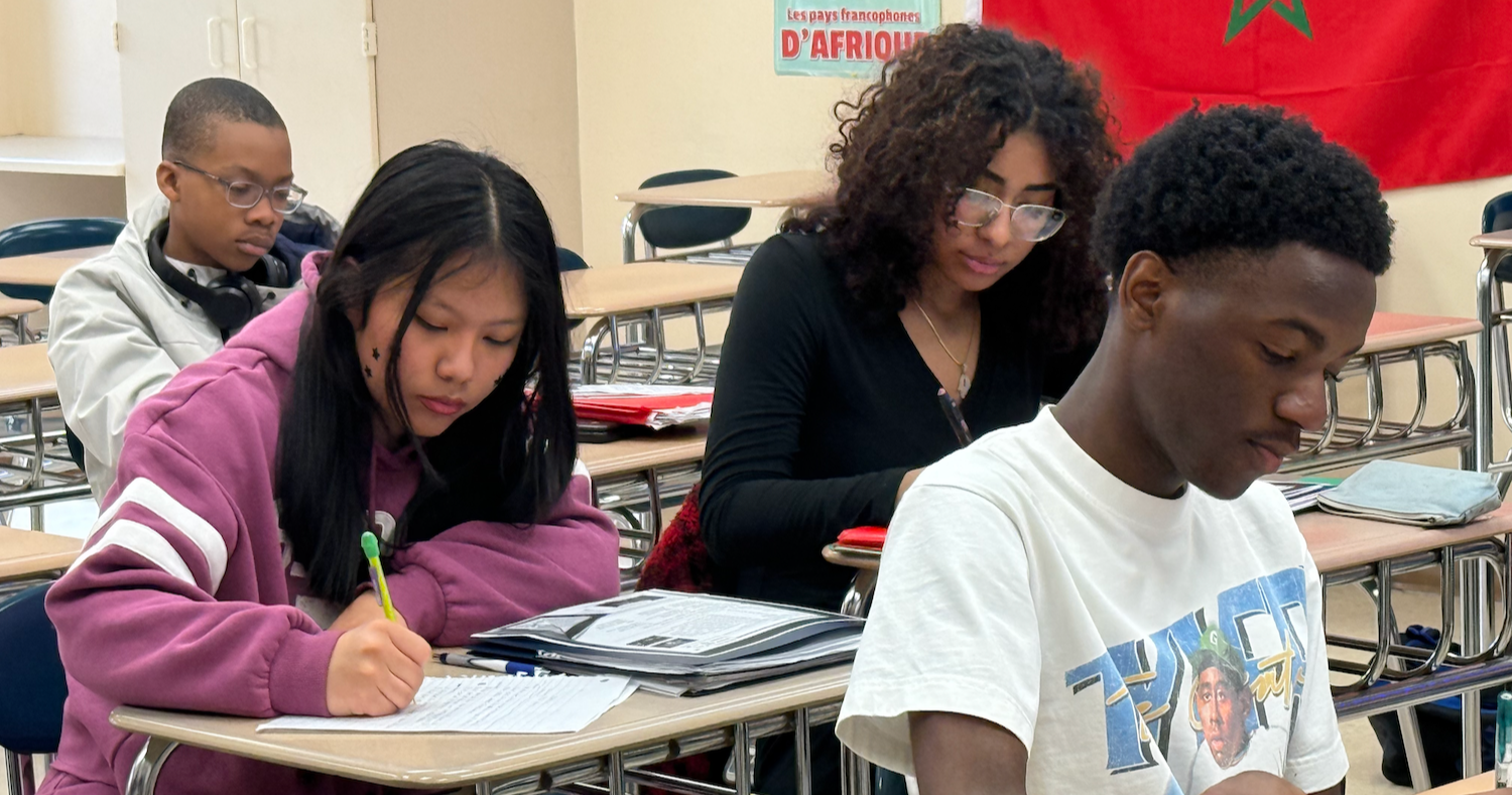 four students studying in class