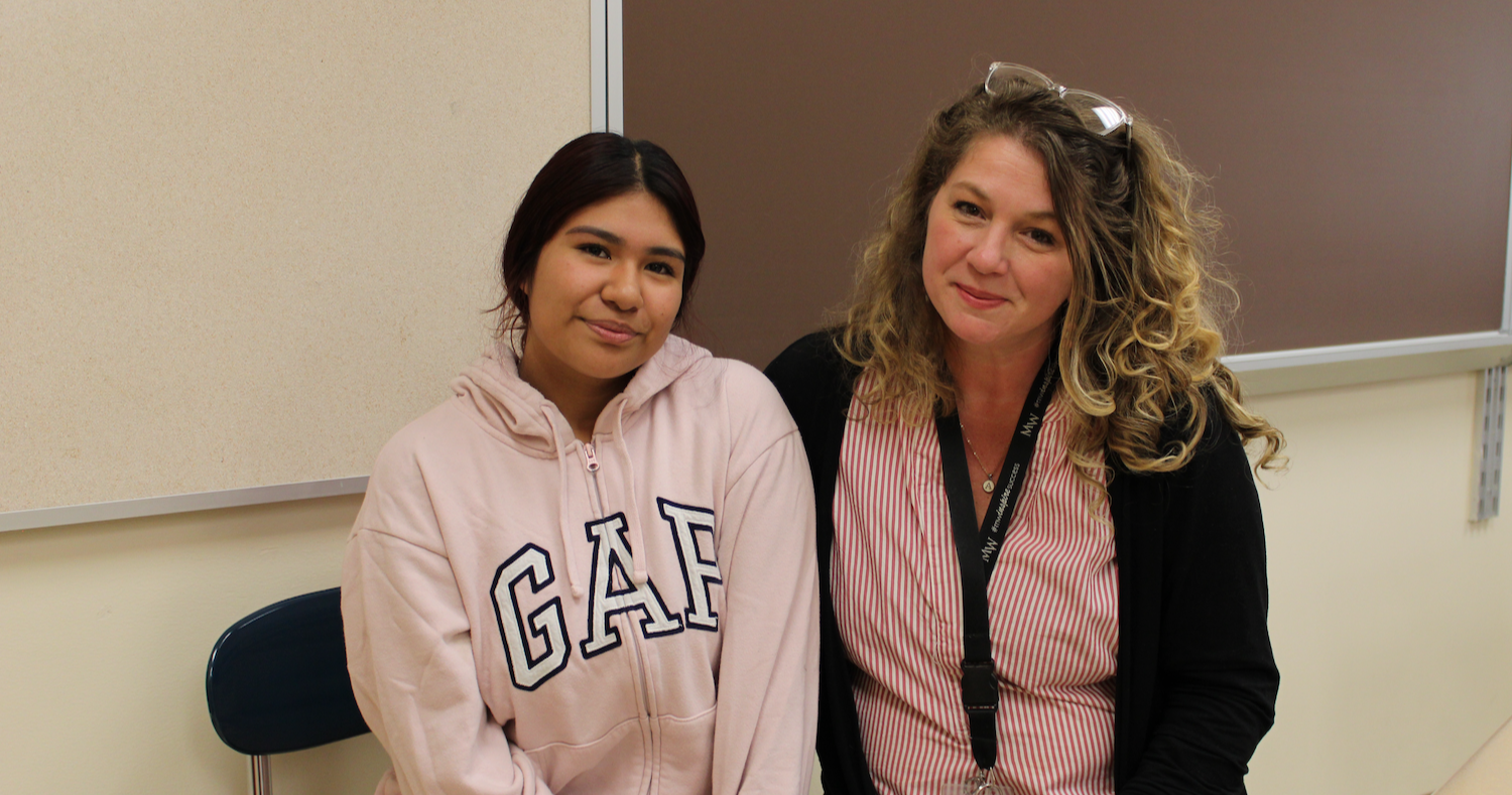 student and teacher wearing pink shirts