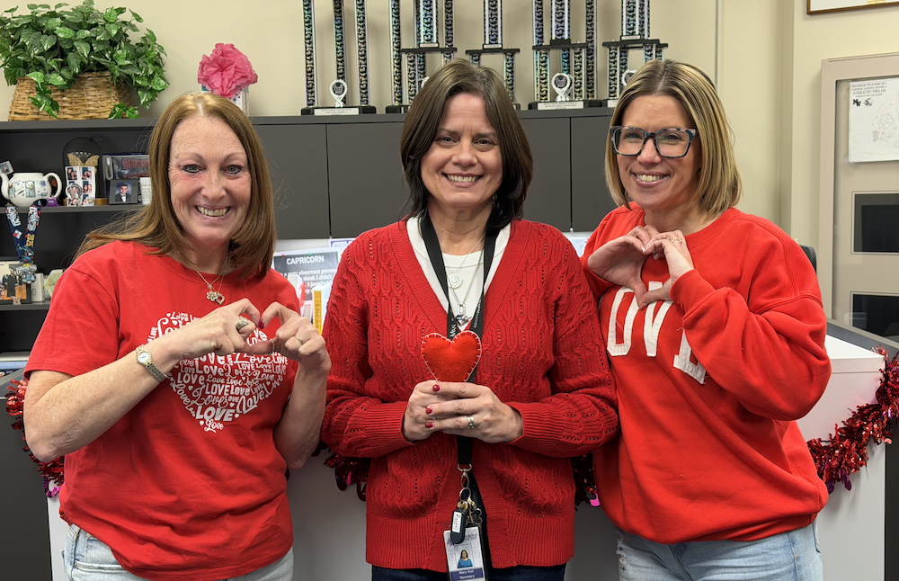 vice principal and front office staff wear red for heart health