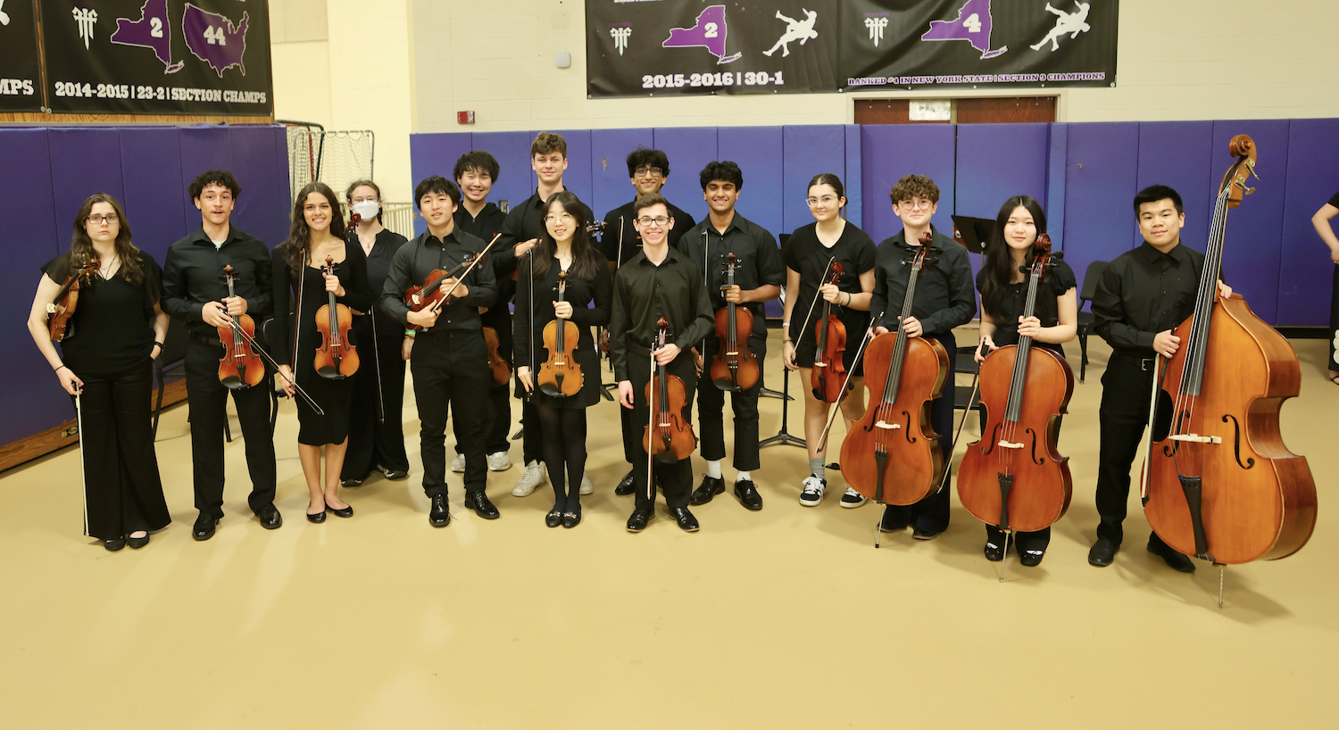 musicians standing with instruments