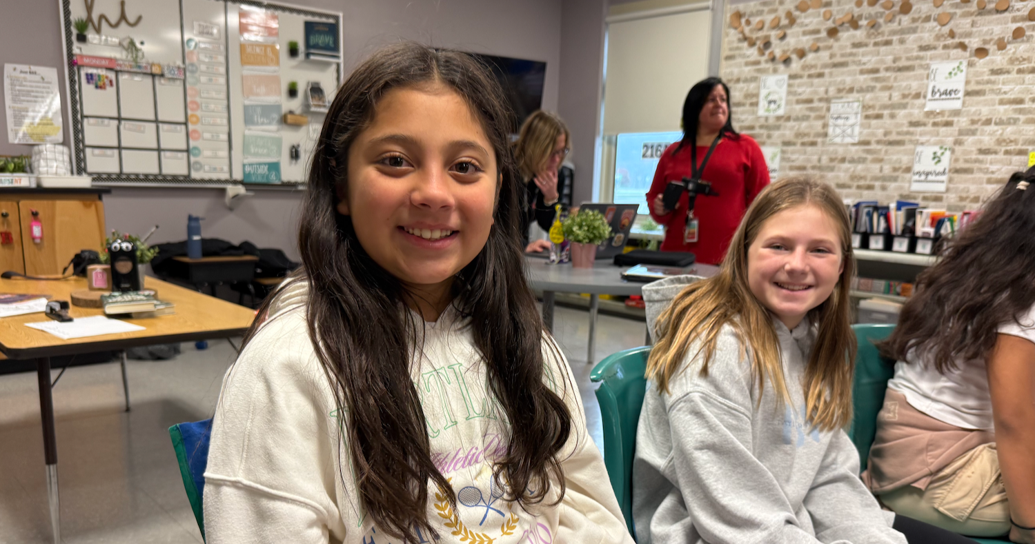 two students sitting in class