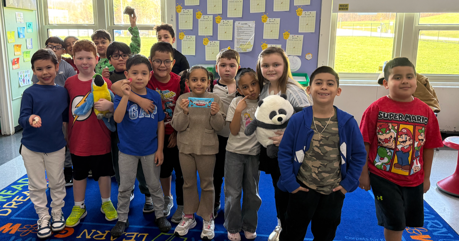 class standing on colorful rug