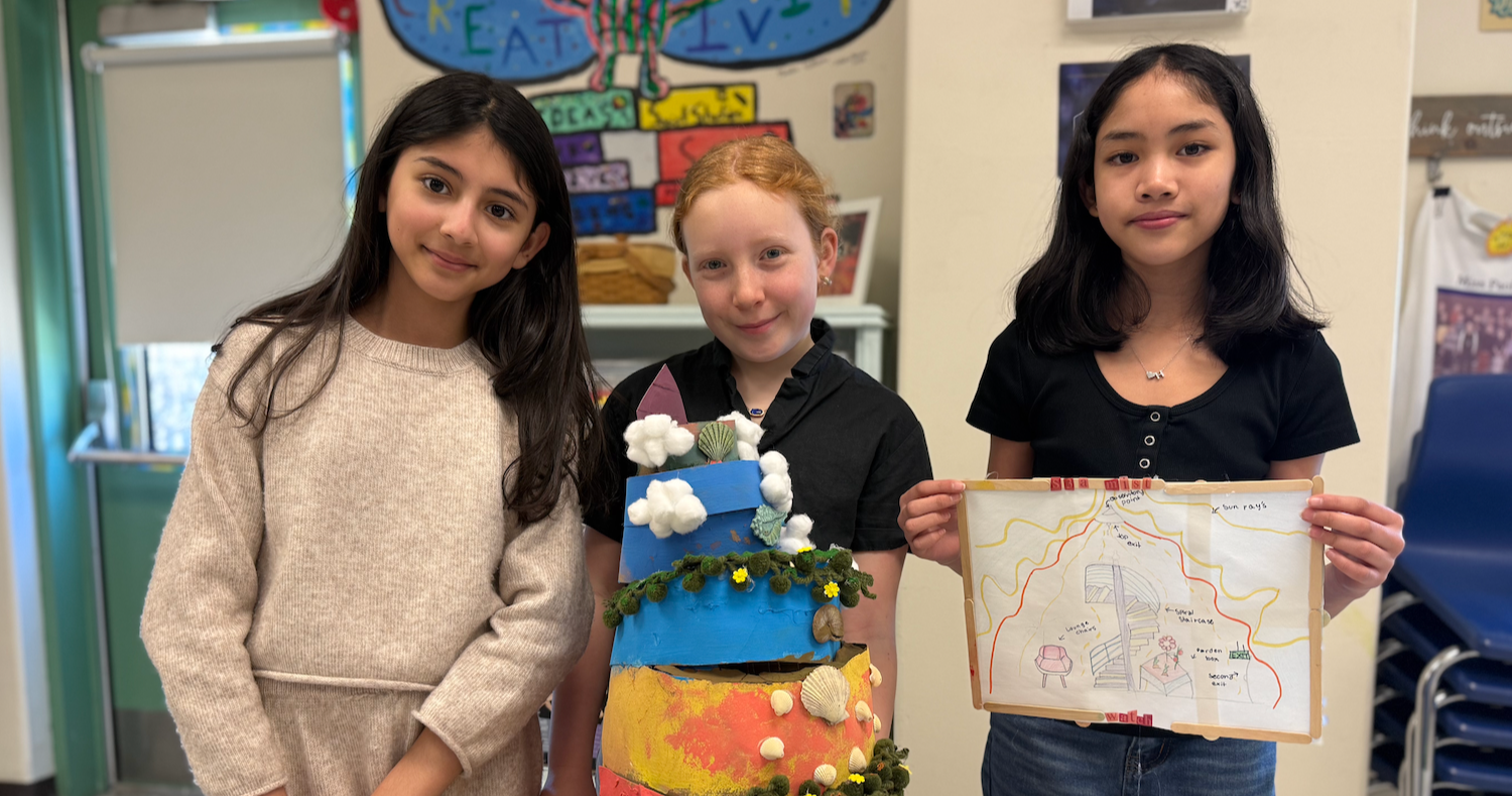 three students standing in clas