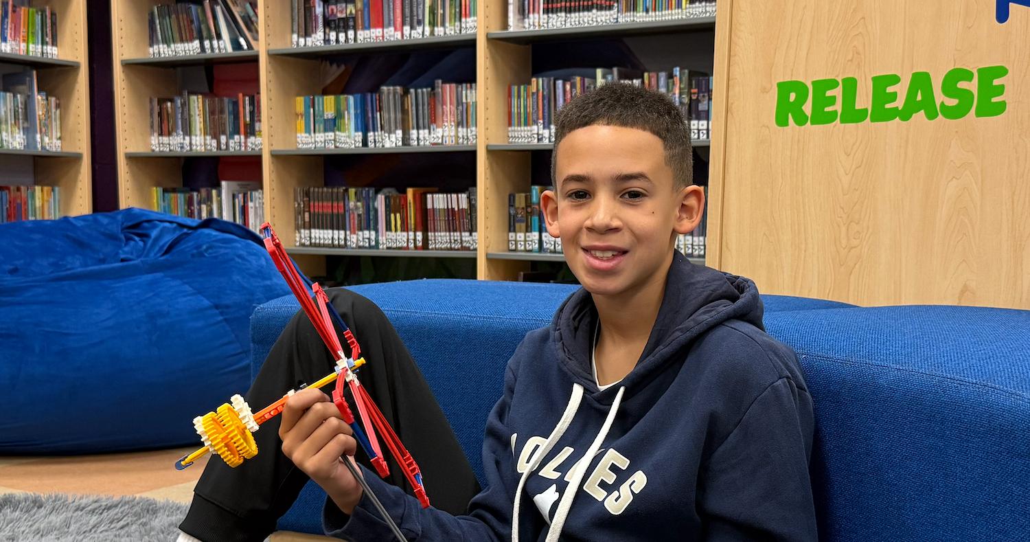 student sitting in library