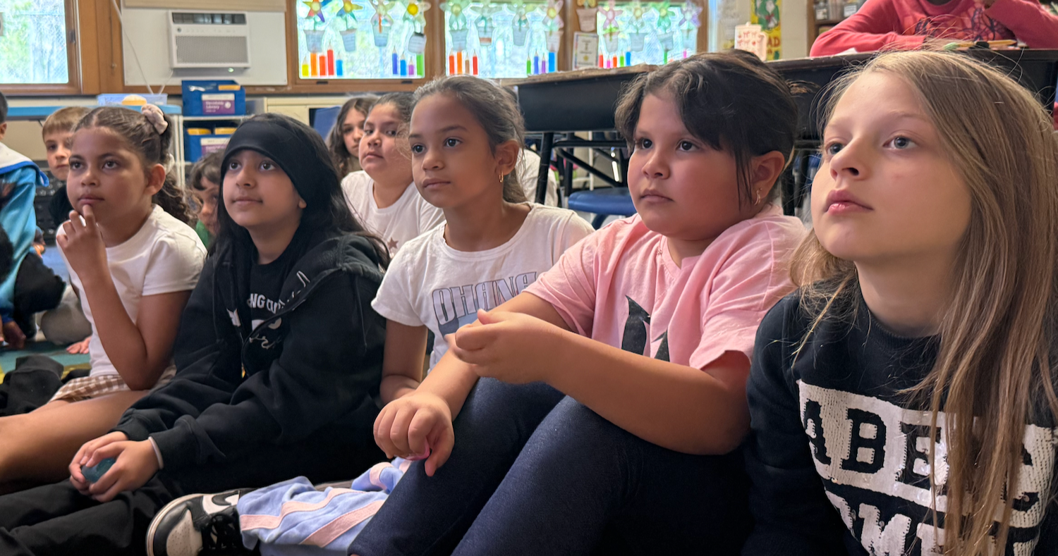 students sitting on floor
