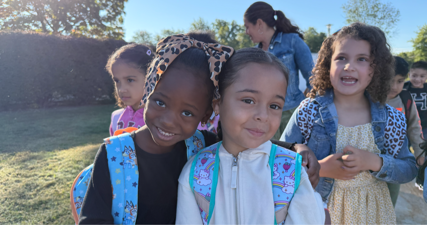 two students with blue bookbags