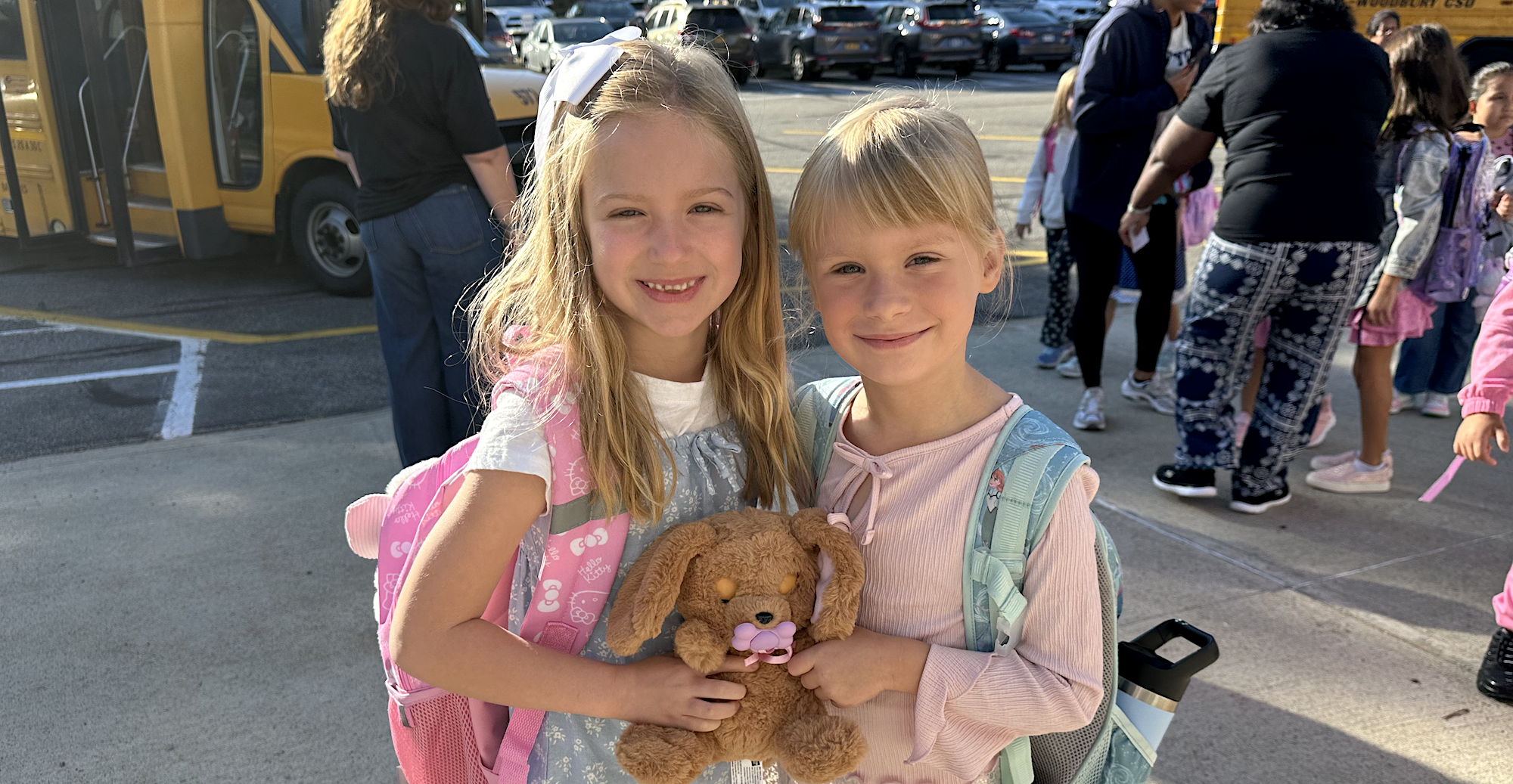 two girls with stuffed animal