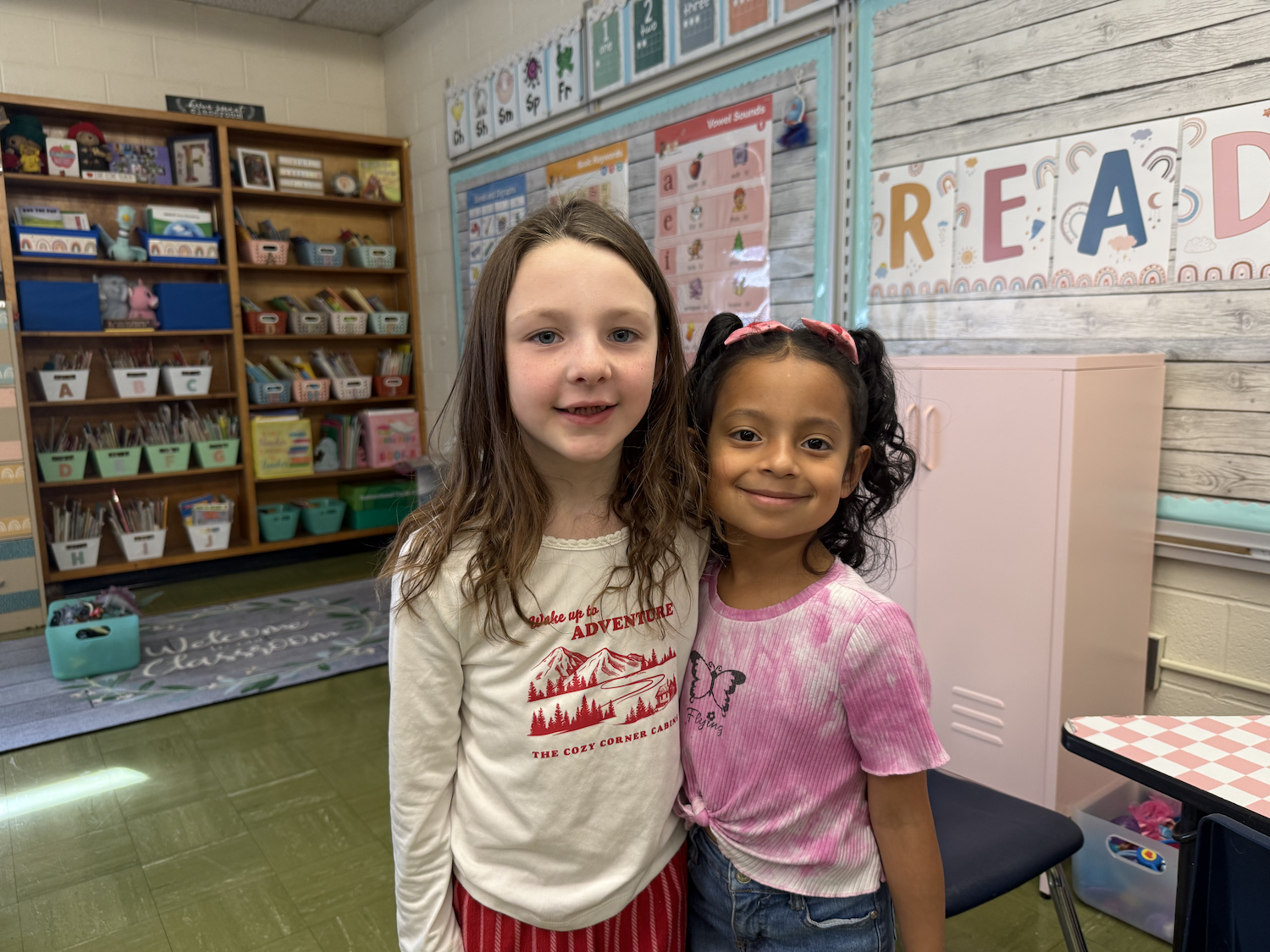 two students wearing pink and white shirts