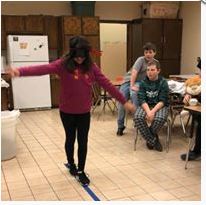 A photo of a student doing a balance exercise.