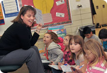 Teacher talking with her students