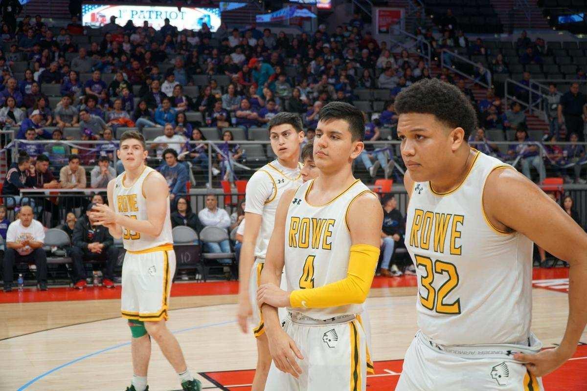 Basketball players standing on the court