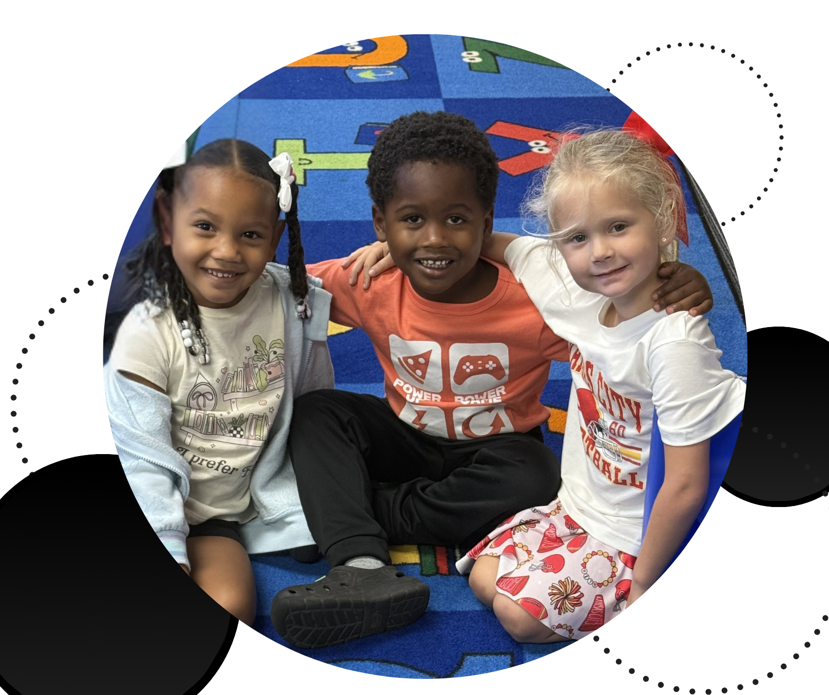Kids sitting on carpet with arms around each other
