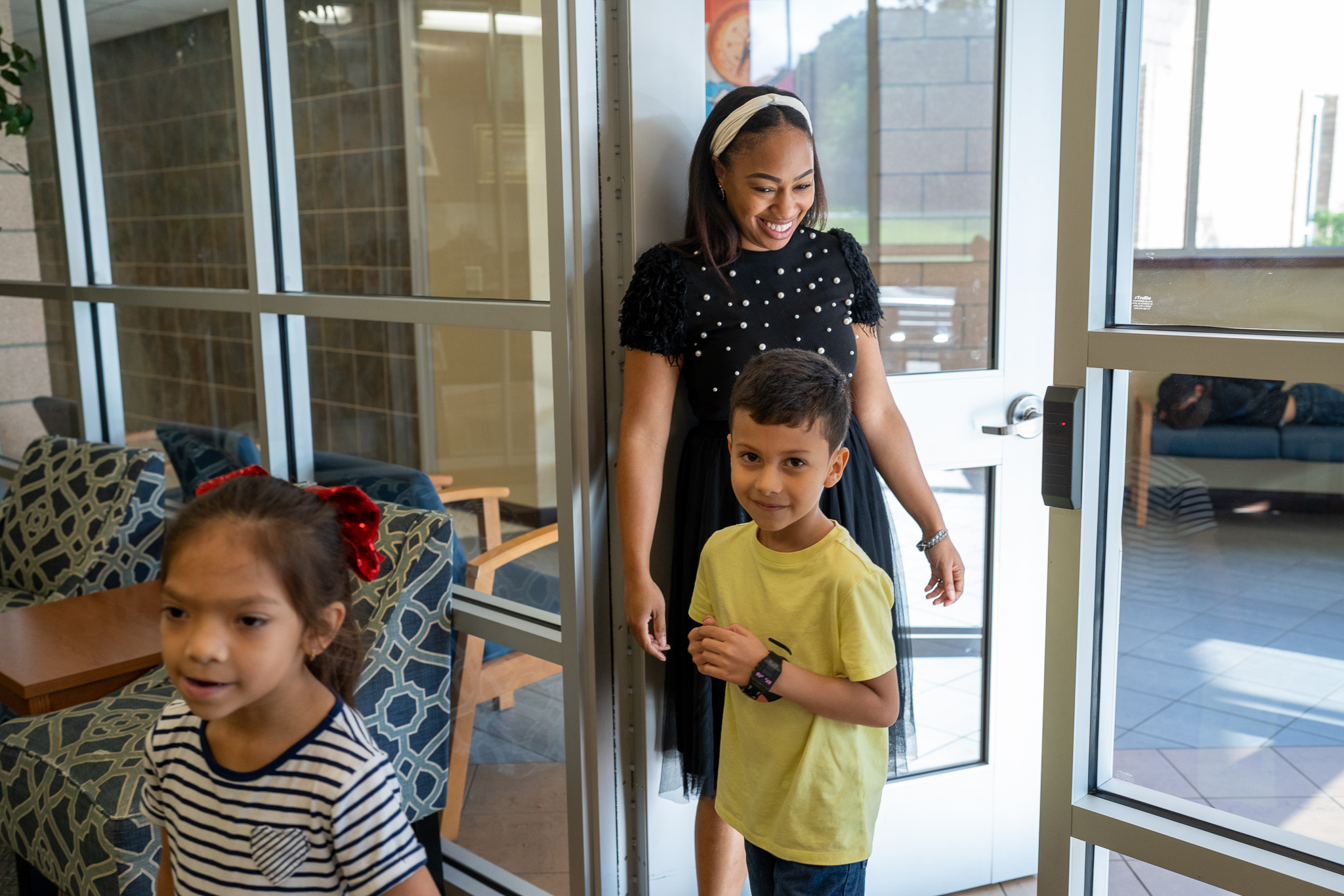 principal opening door for student