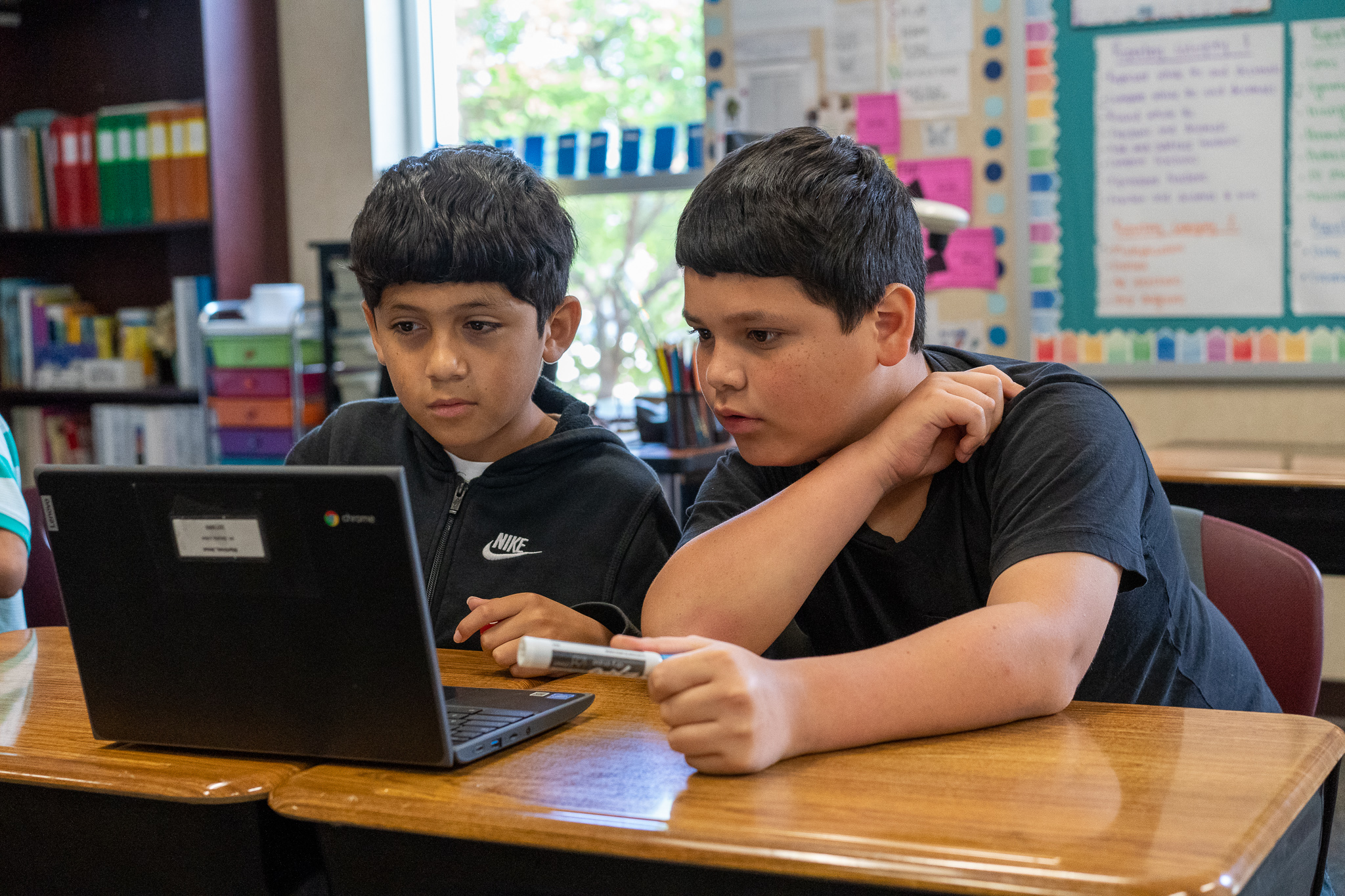 students working on chromebook