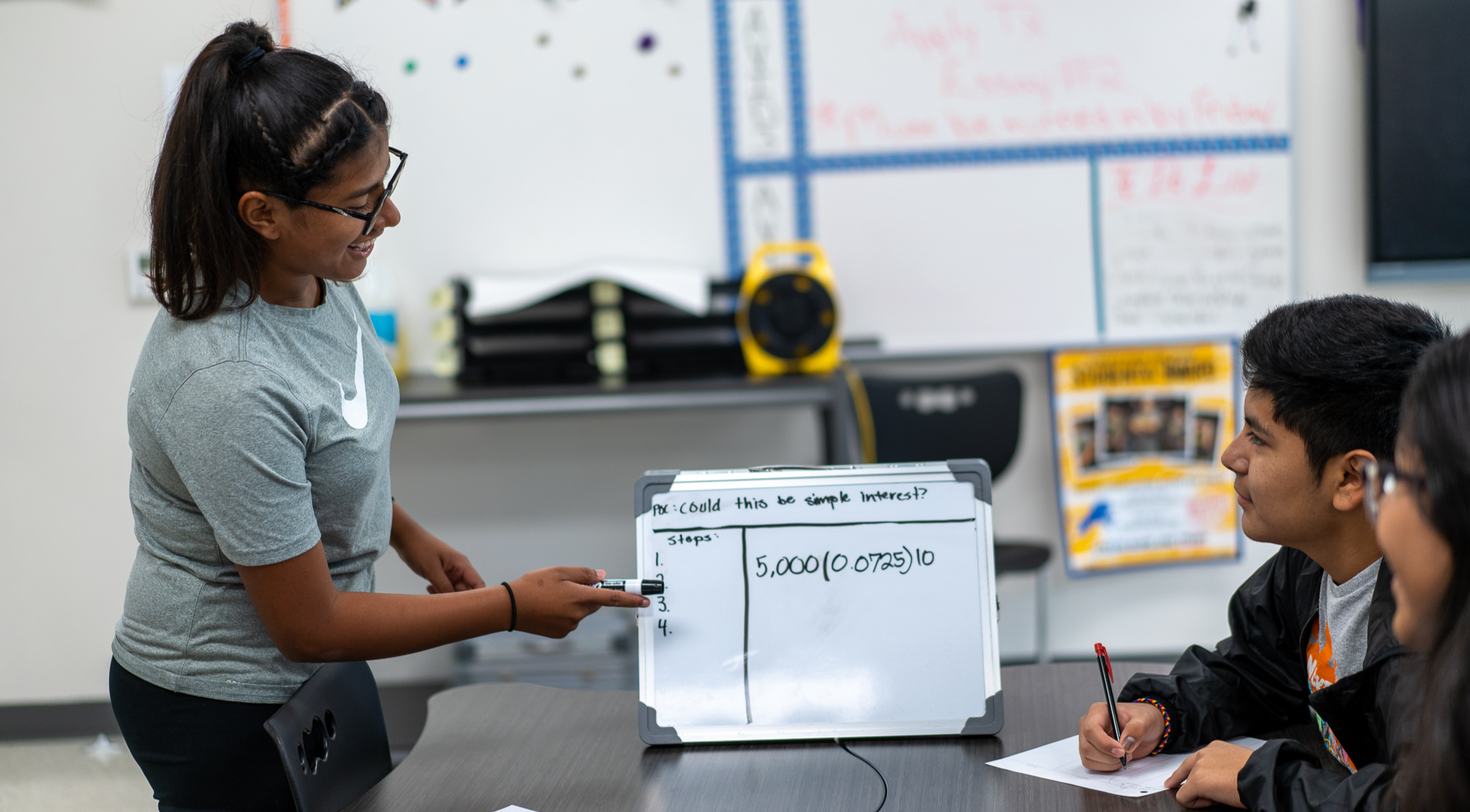 tutor working with student at Tyler High school