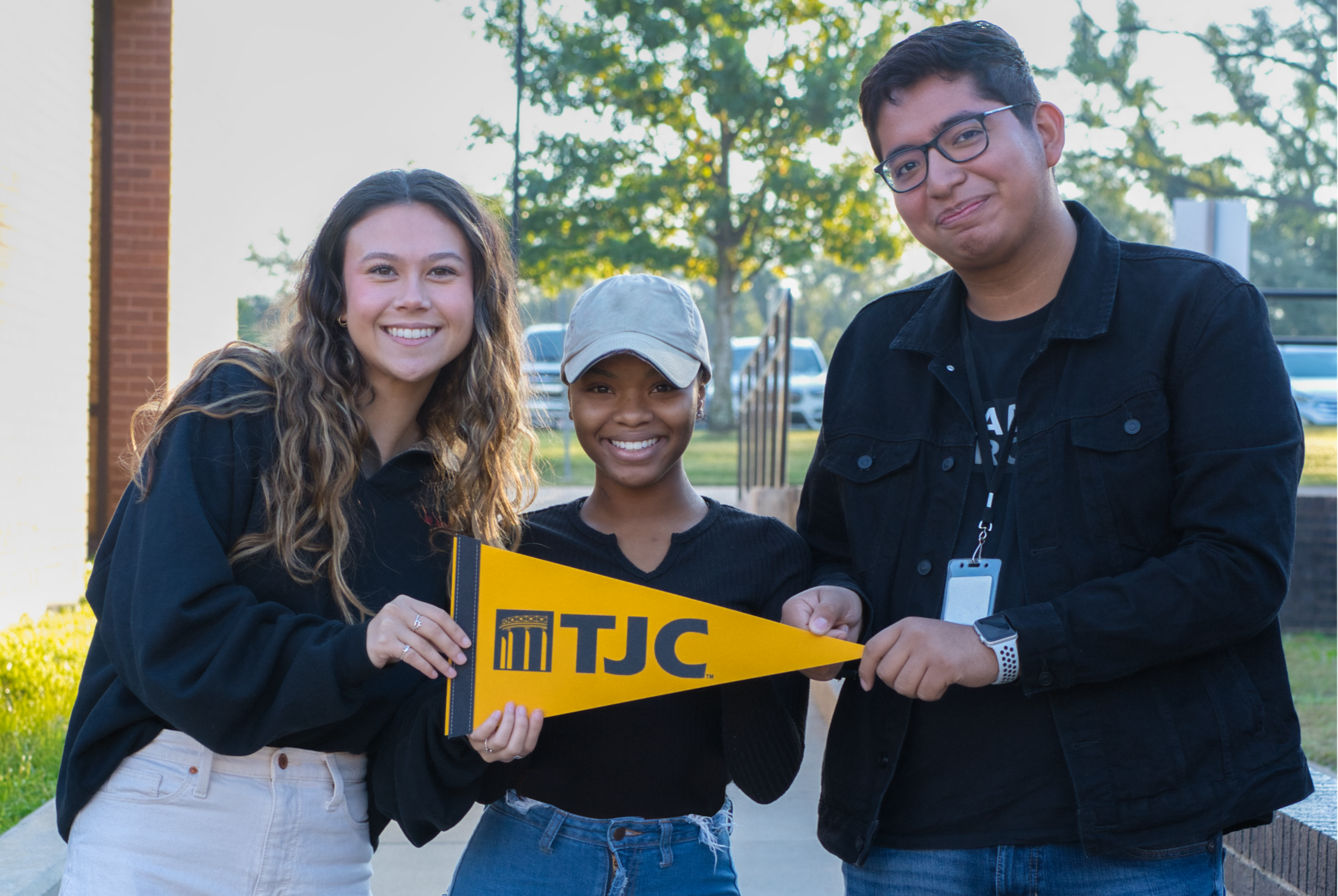 students with pennant of TJC