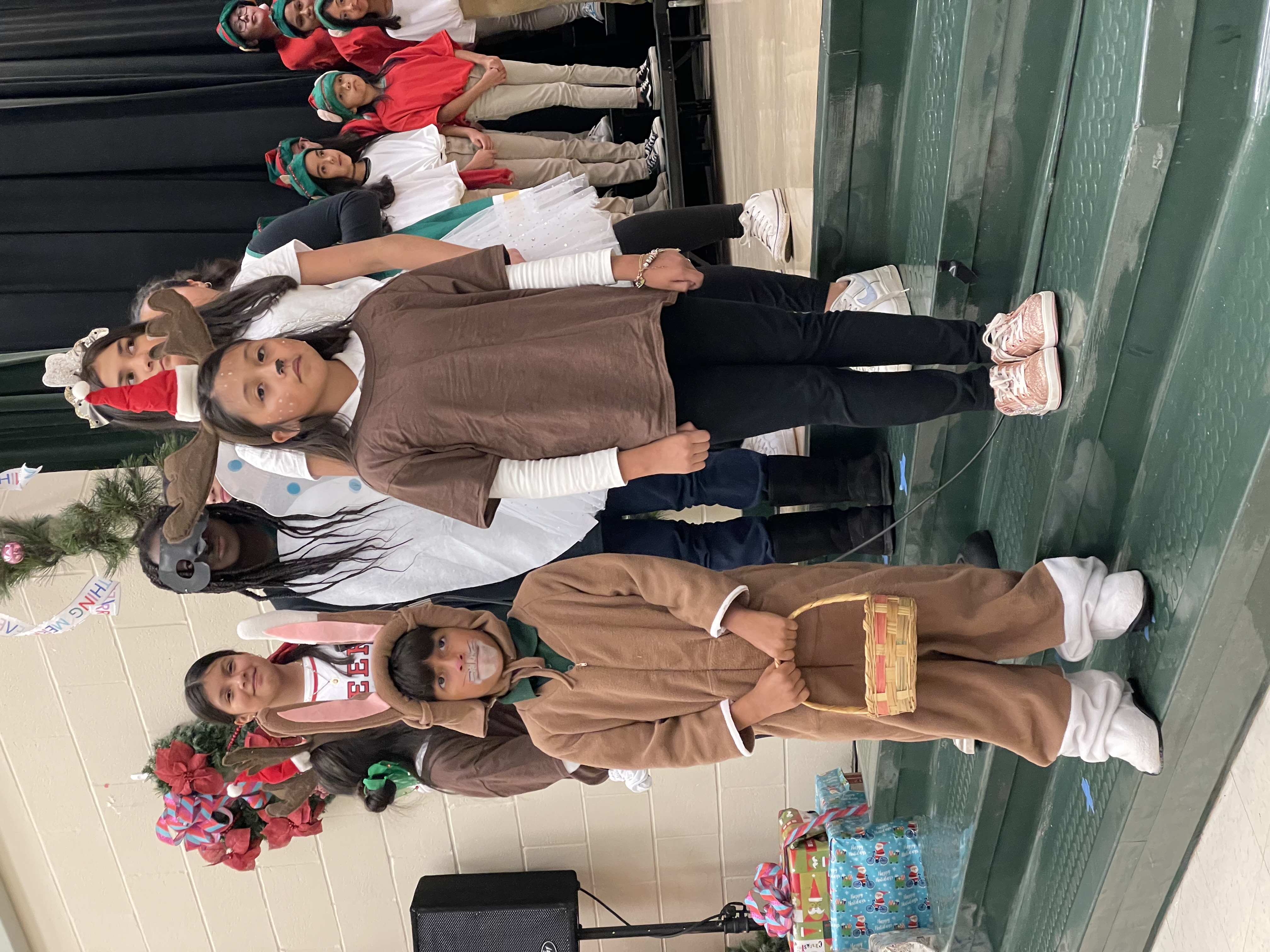 elementary aged kids dressed as reindeer