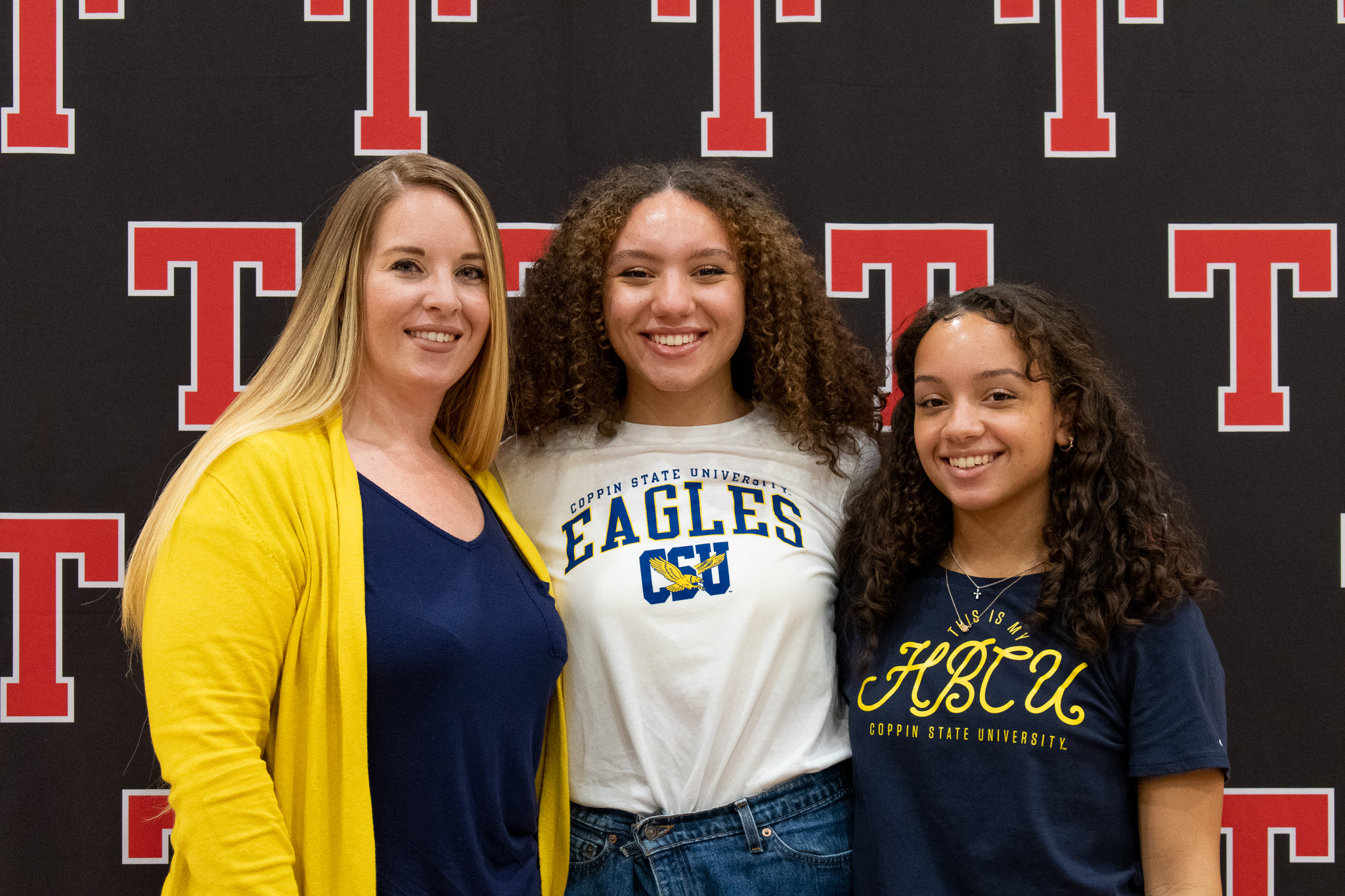 student with family on signing day