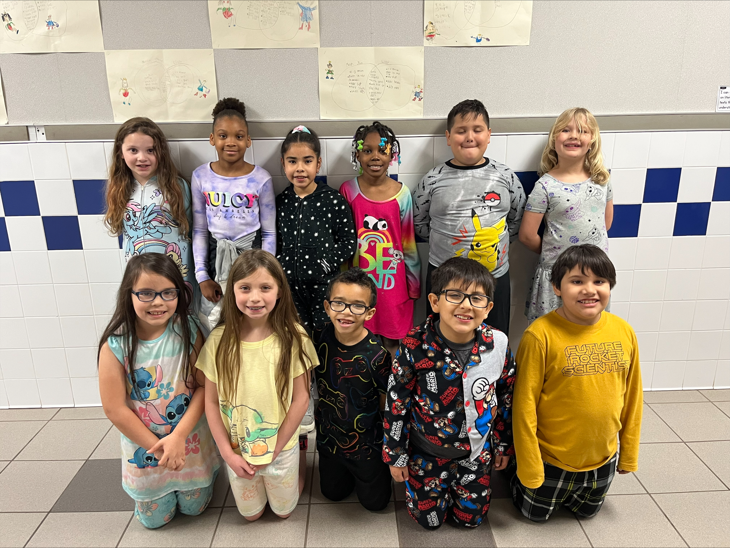group of elementary students in pajamas