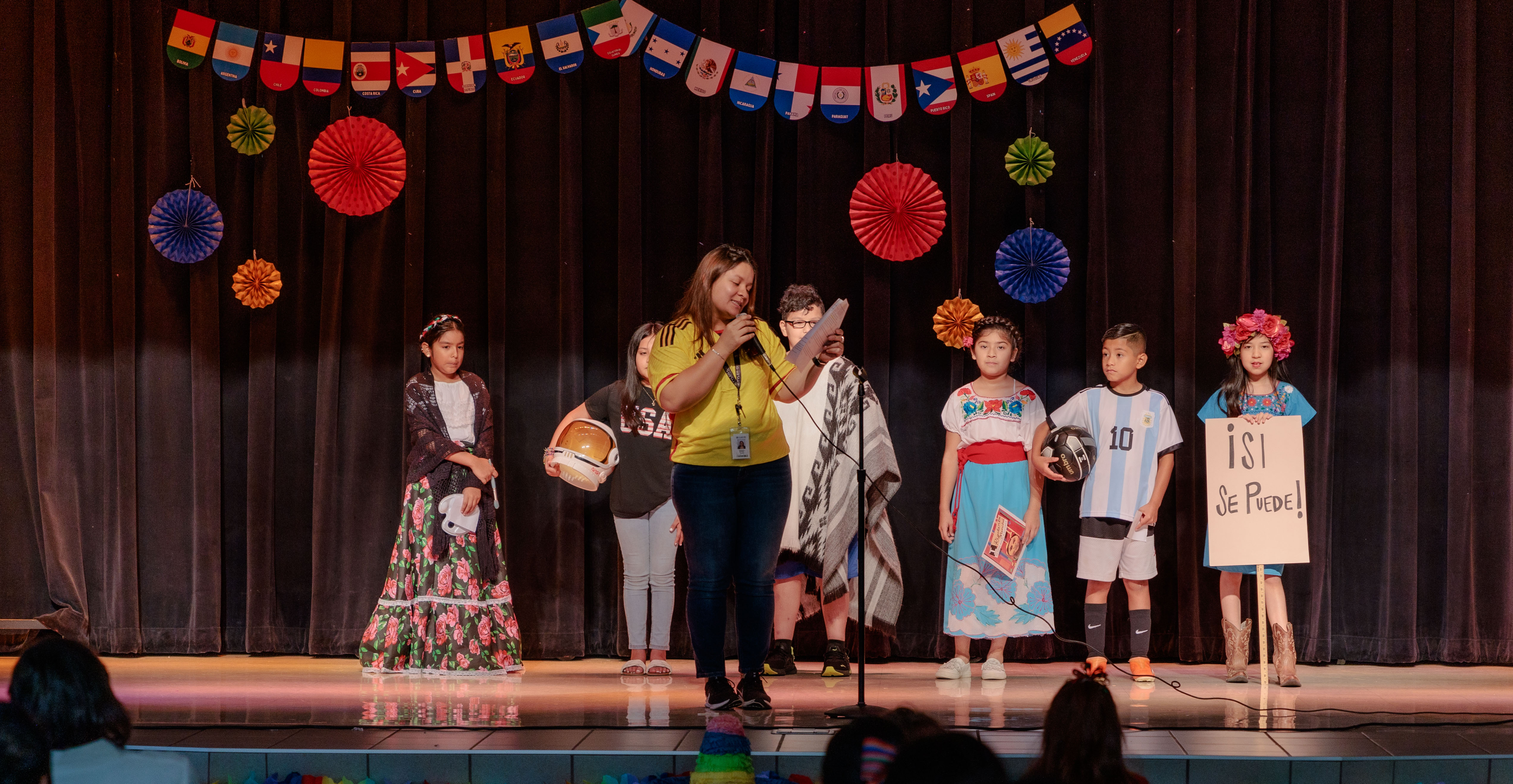 elementary age students dressed in traditional Hispanic clothing