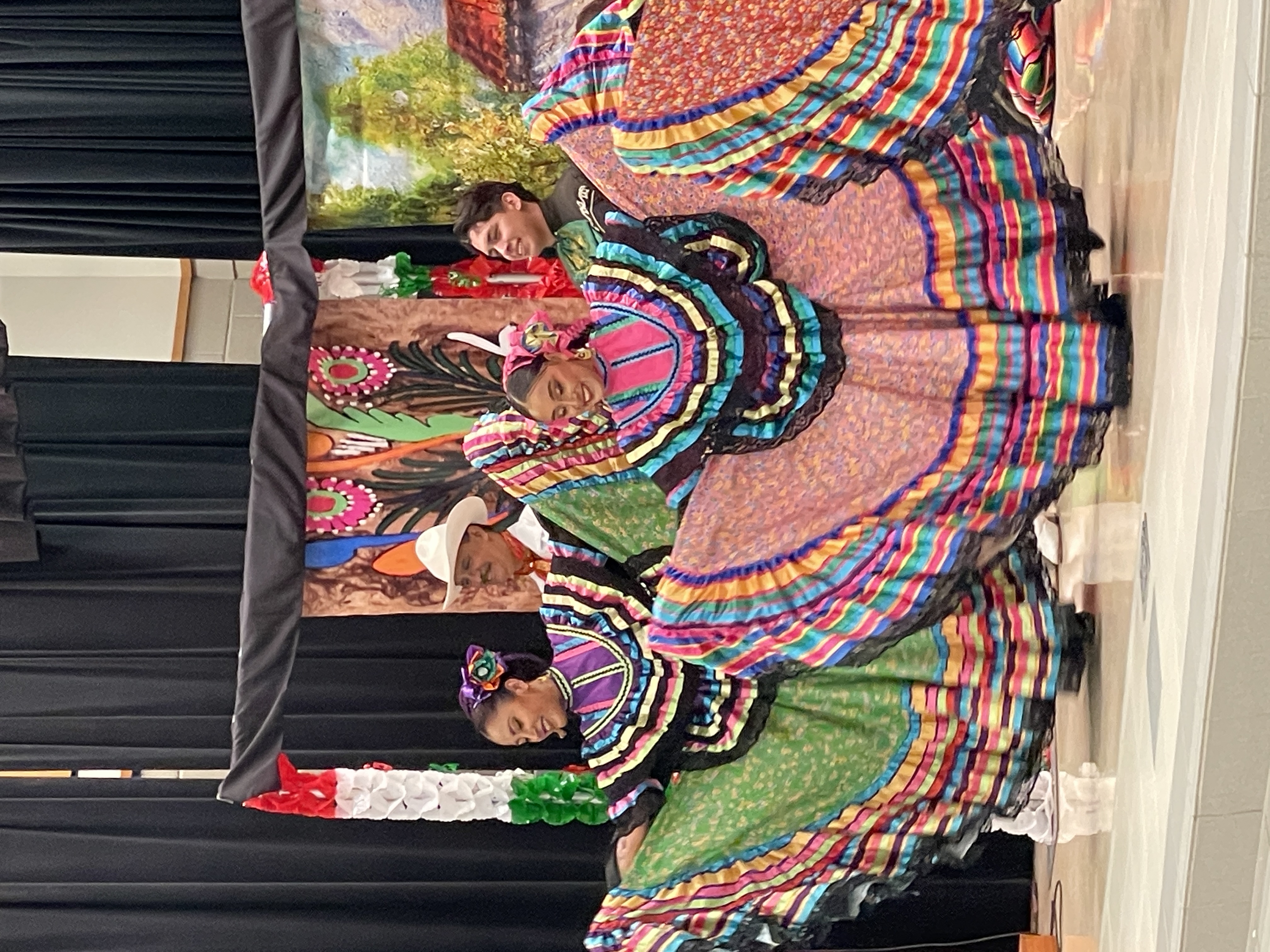 dancers wearing traditional Hispanic attire