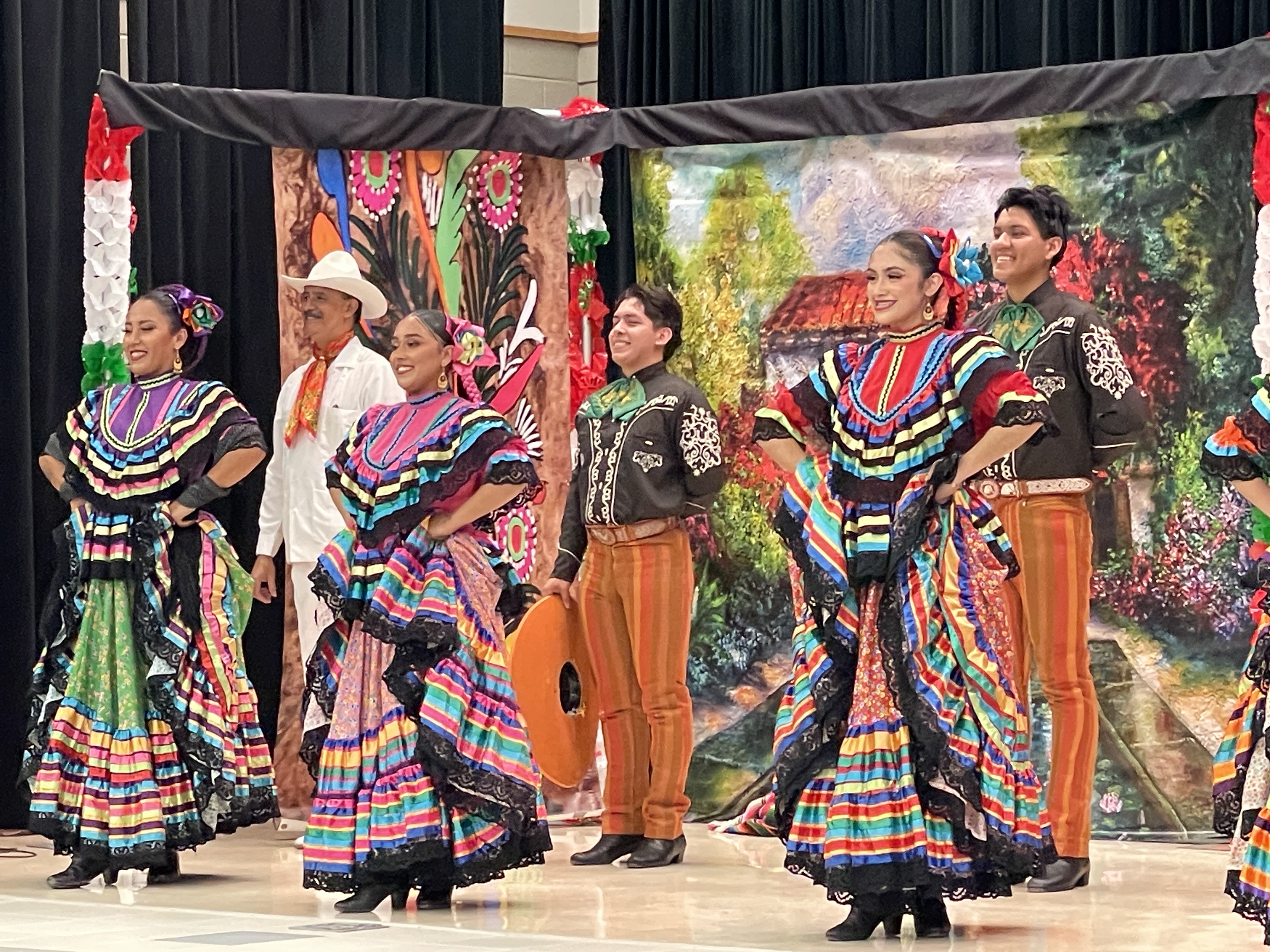 dancers wearing traditional Hispanic attire