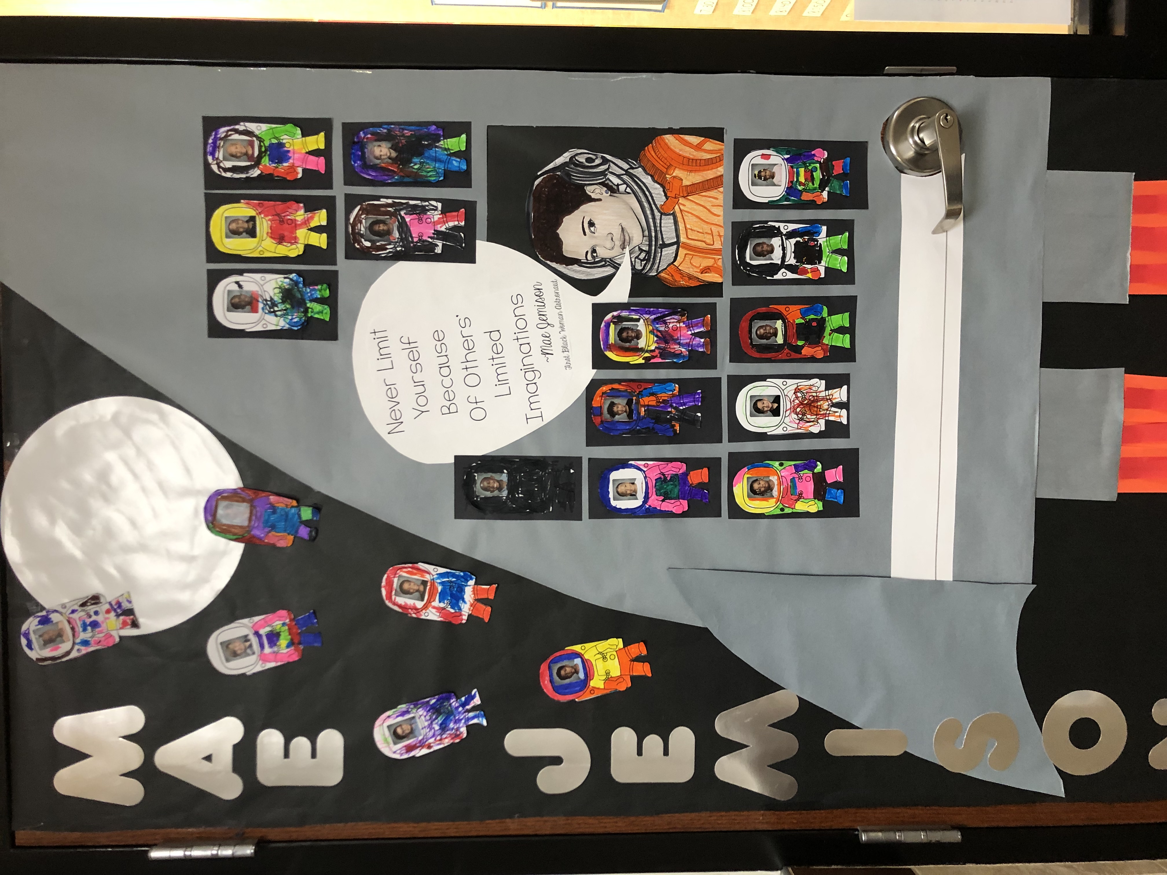 decorated door with Mae Jemison and small astronaut cutouts