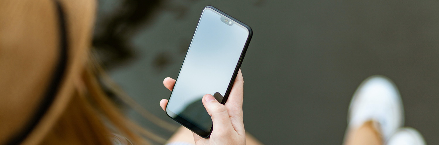 Caucasian female hand holding a cell phone